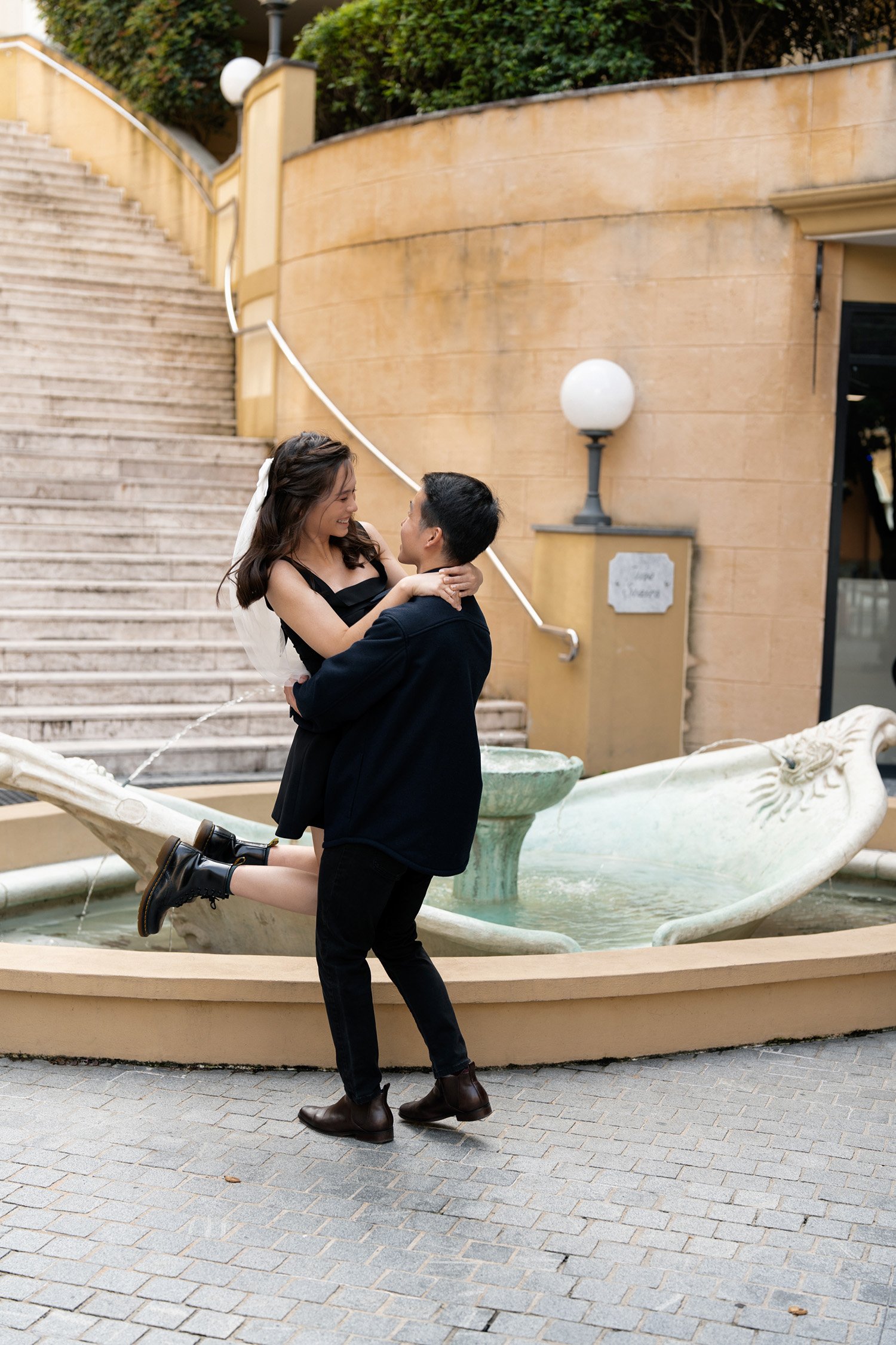 Paul holding of Krystel and look at her in their engagement photoshoot session