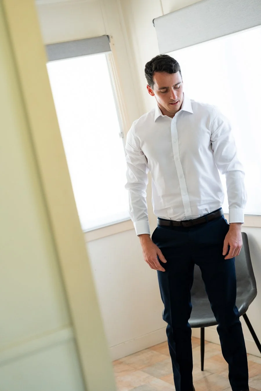 The groom stood up, looking down at the ground