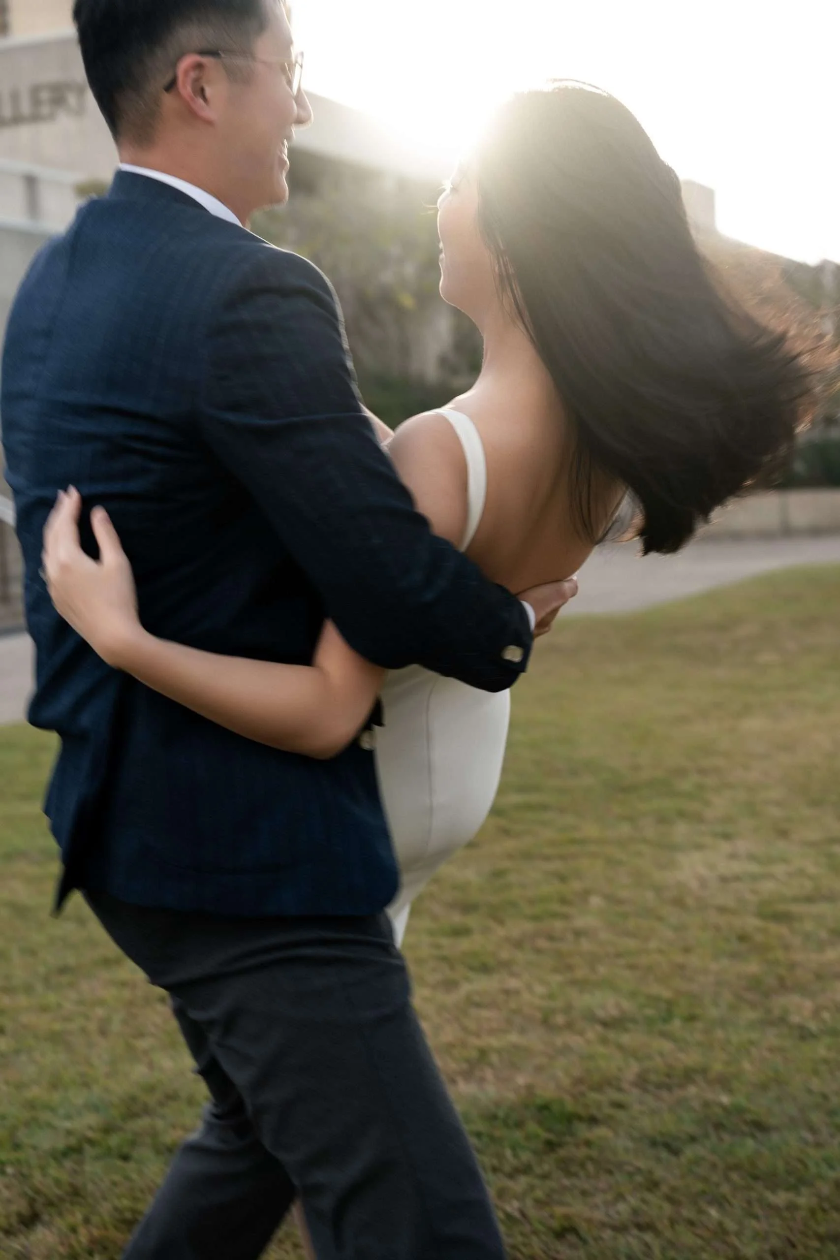 Dave gently holding Kath, creating an intimate and affectionate moment as they share a close connection and warmth