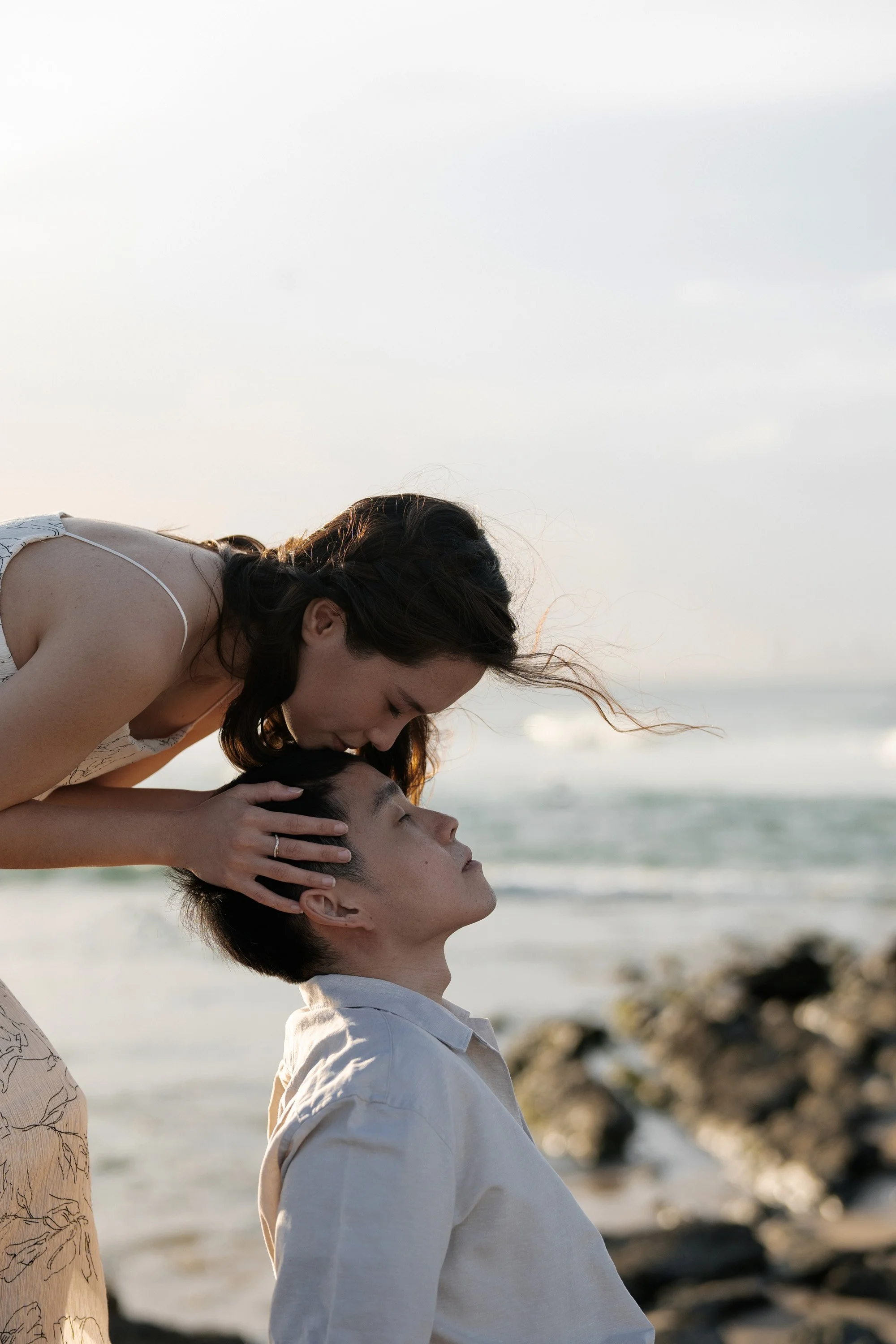 Krystel kissing Paul's forehead