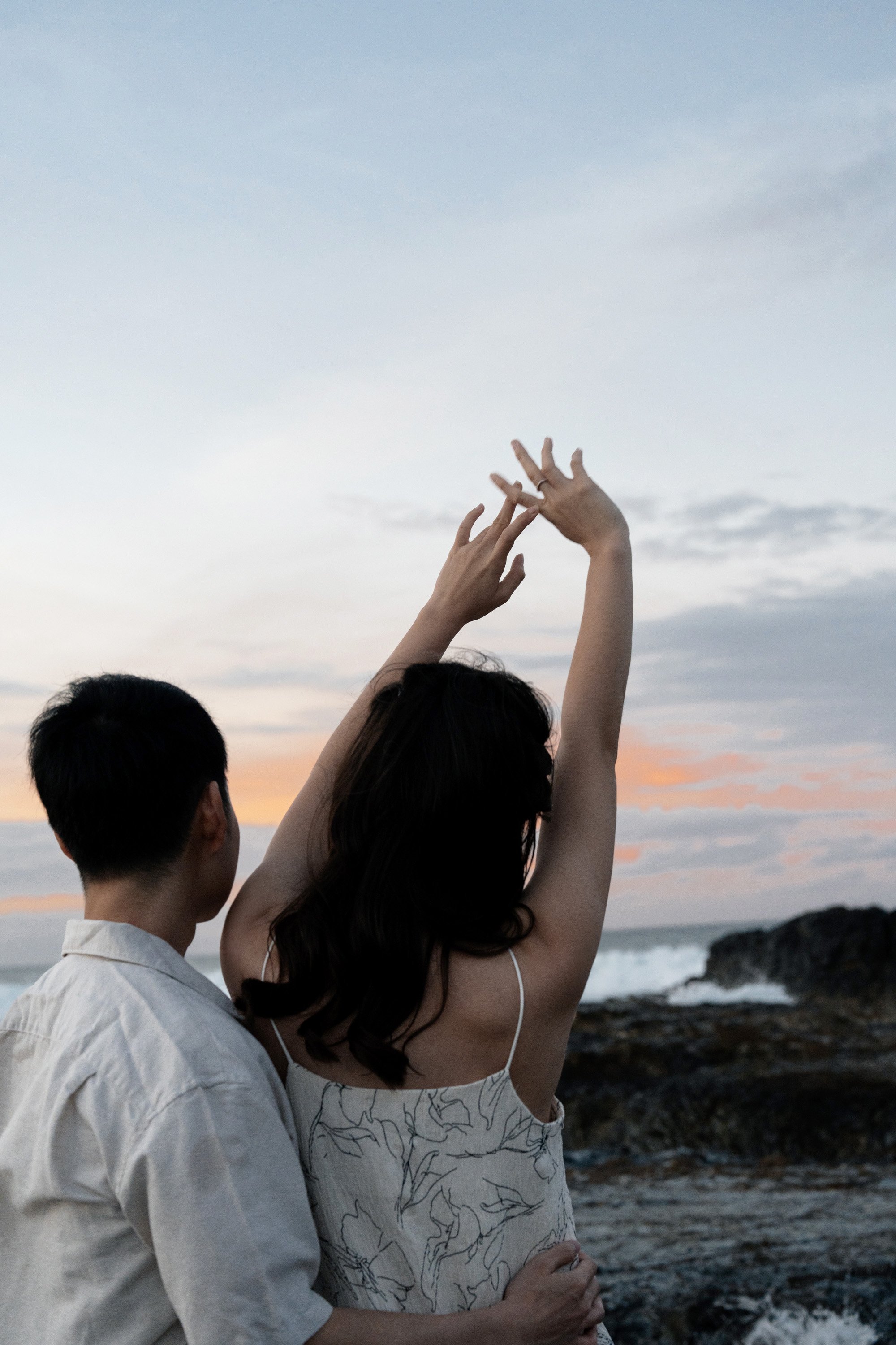 Krystel hands up and Paul holding her wist