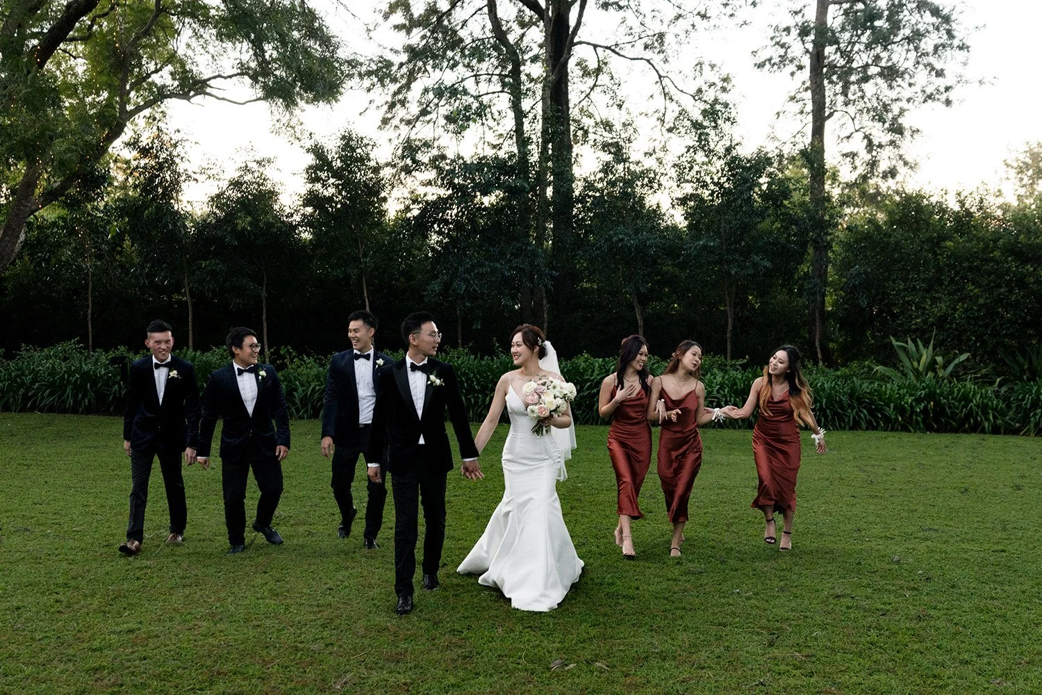 bridal party walking together towards to the camera in gabbinbar homestead