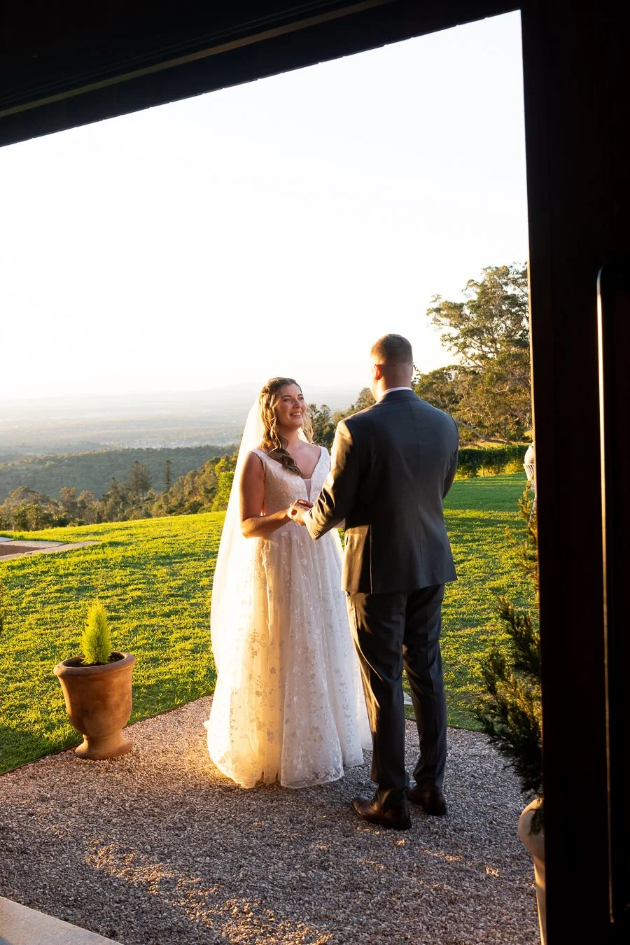 bride Chiarra and groom ben hands holding with stretch look at each other