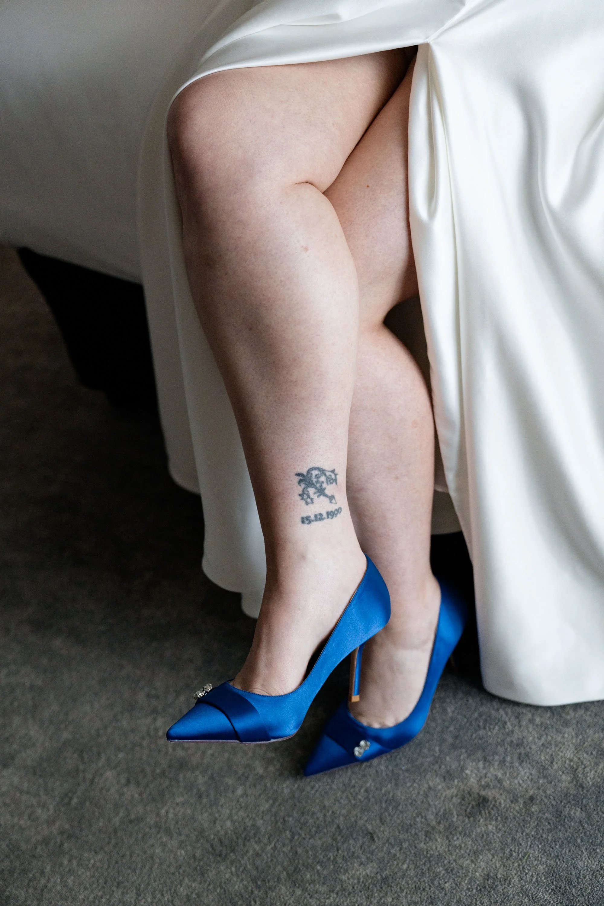 Close-up of blue high heels, adding a pop of color and style to the bride's wedding attire