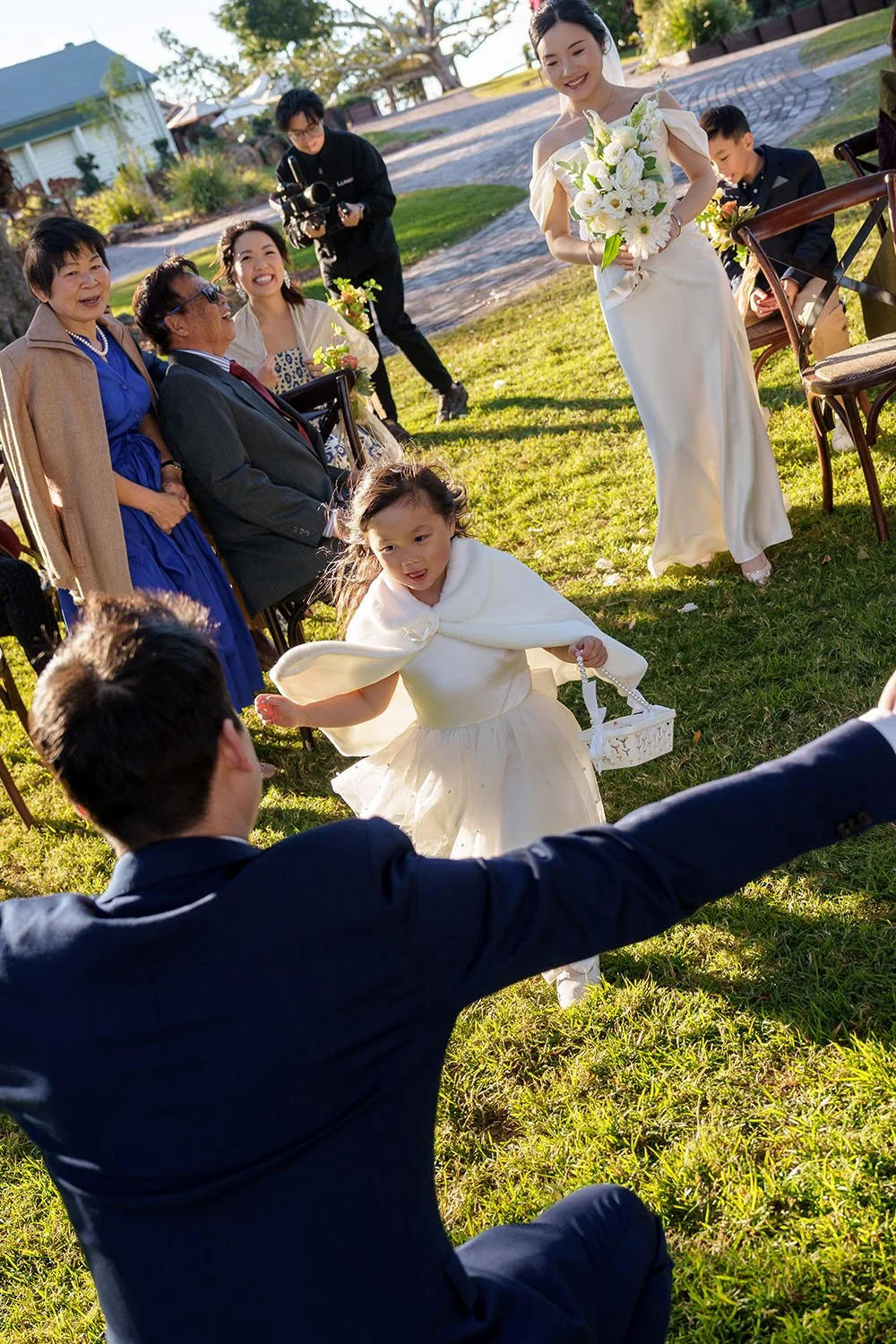 a flower running towards to Eric and he open his arm try to hug her