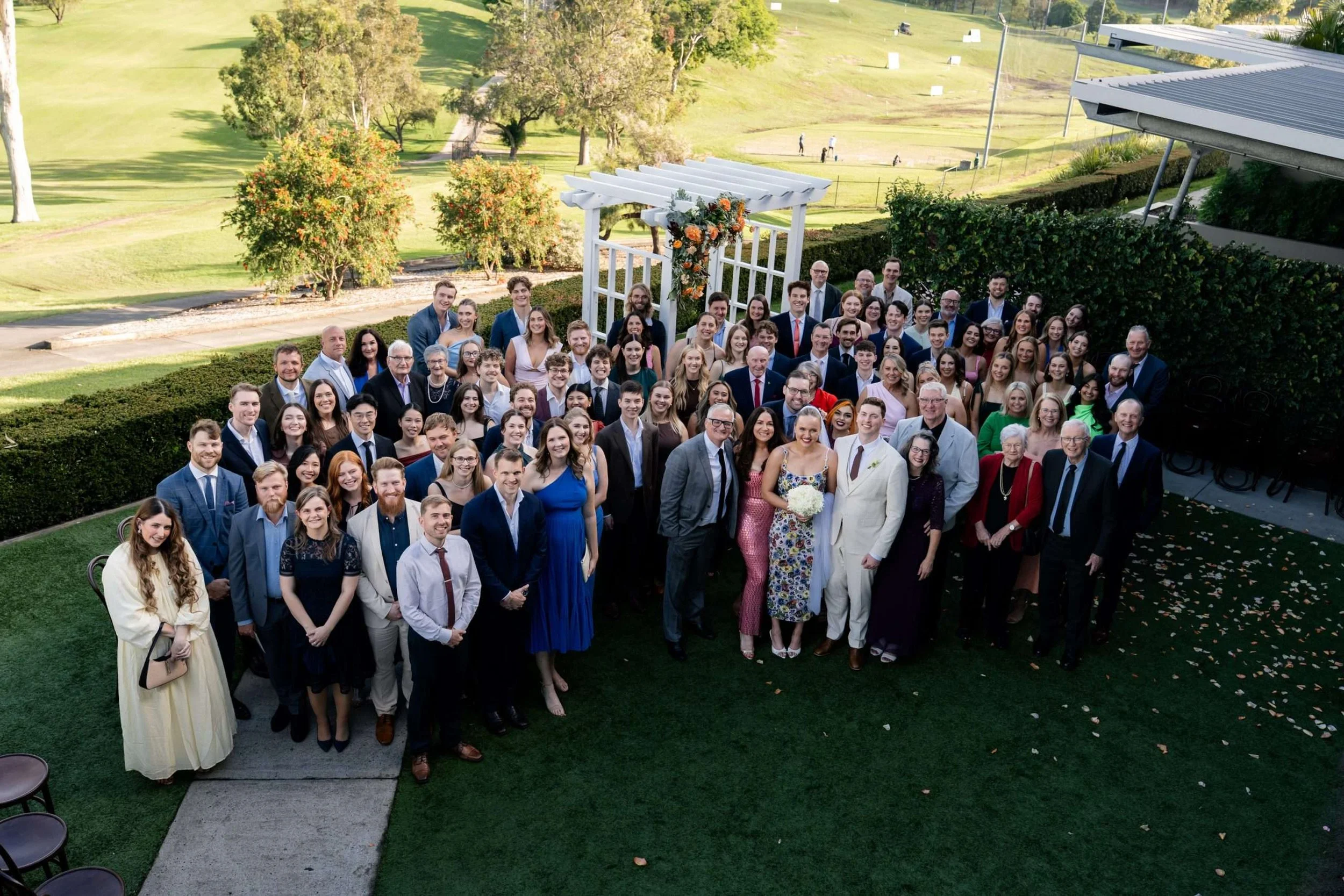 all guests look up to the camera with smile