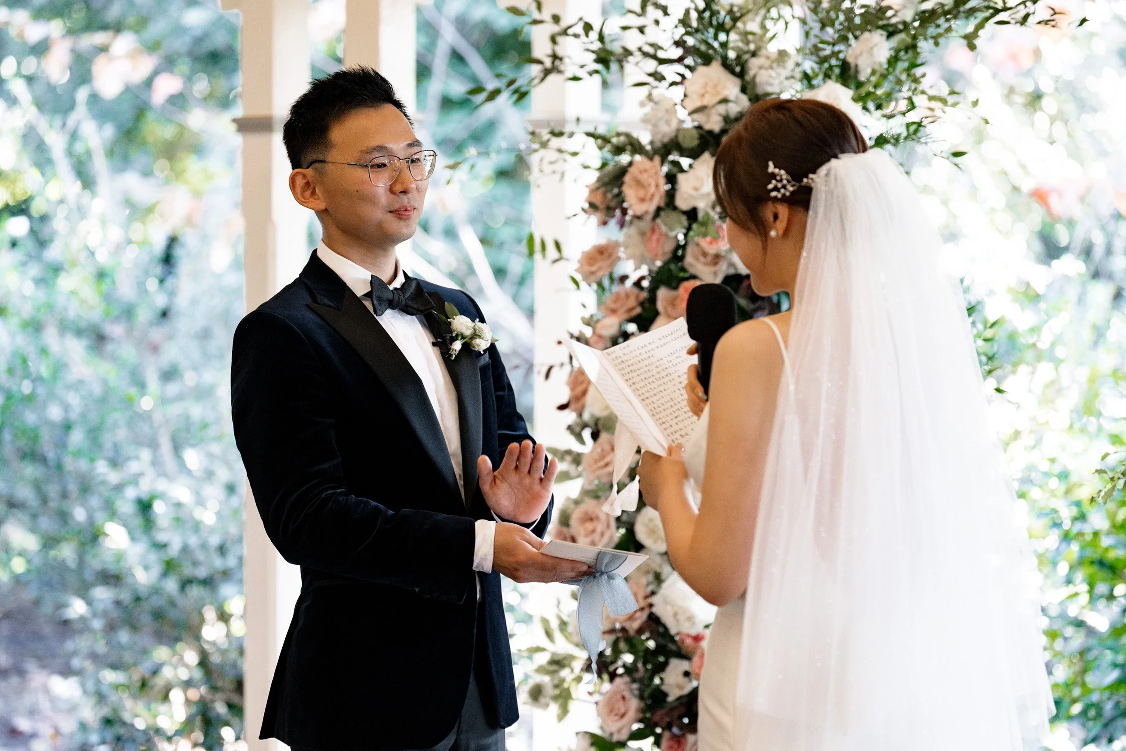 bride Vicky saying her vows and groom claps look at her
