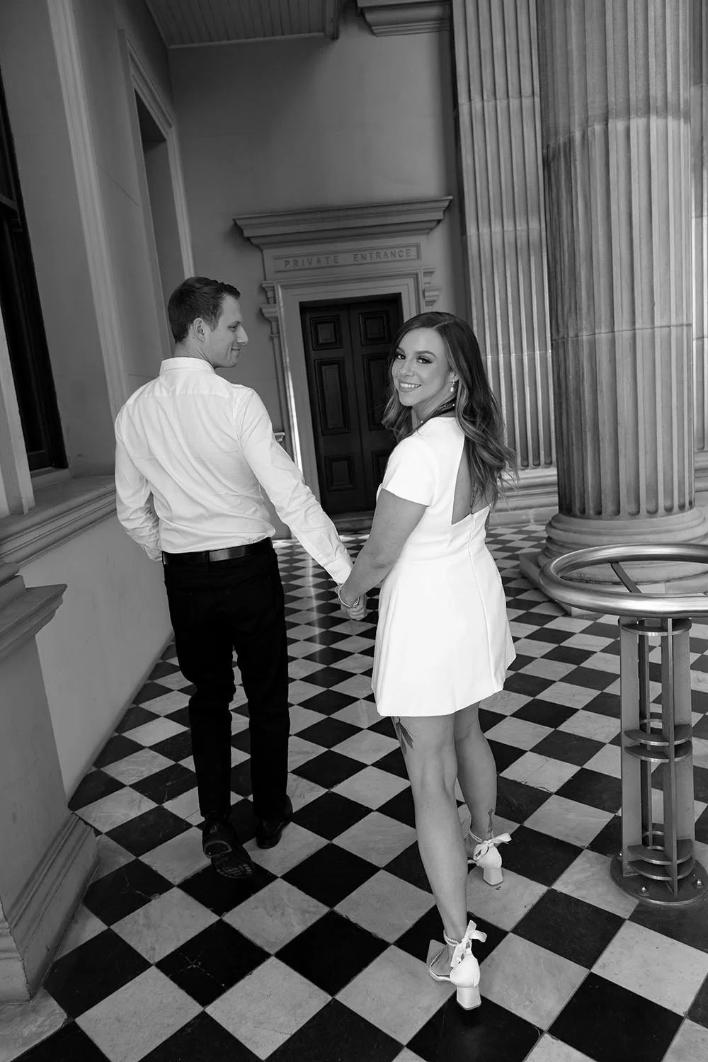 Brenna look back to the camera when two hands holding Morgan's hand