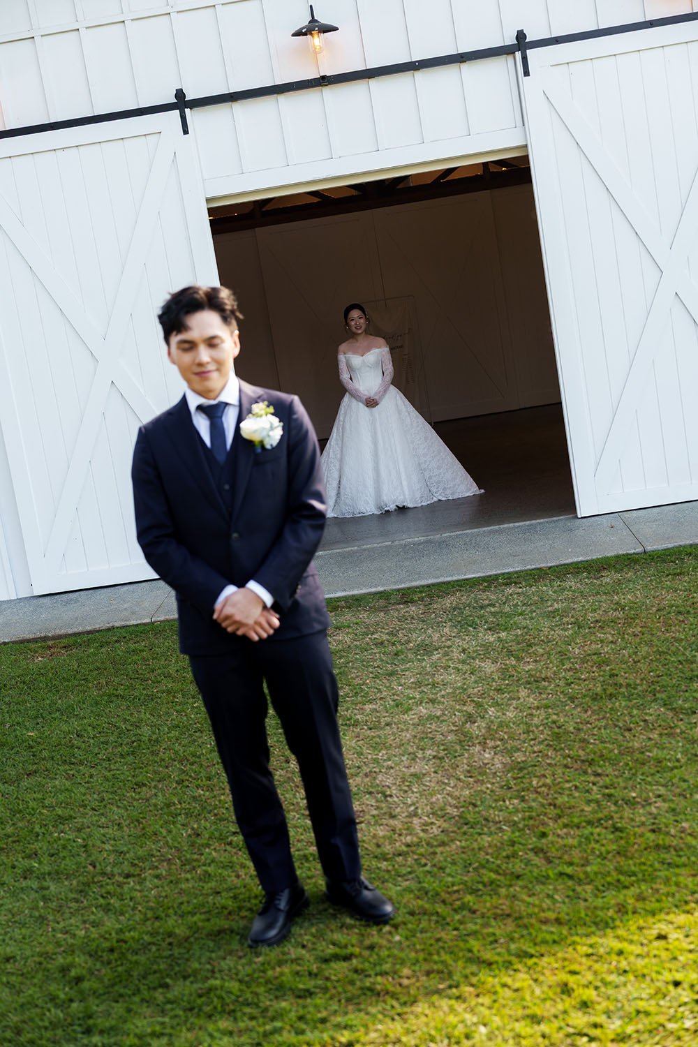 Michael close eyes back facing to Lisa, and Lisa stand far away