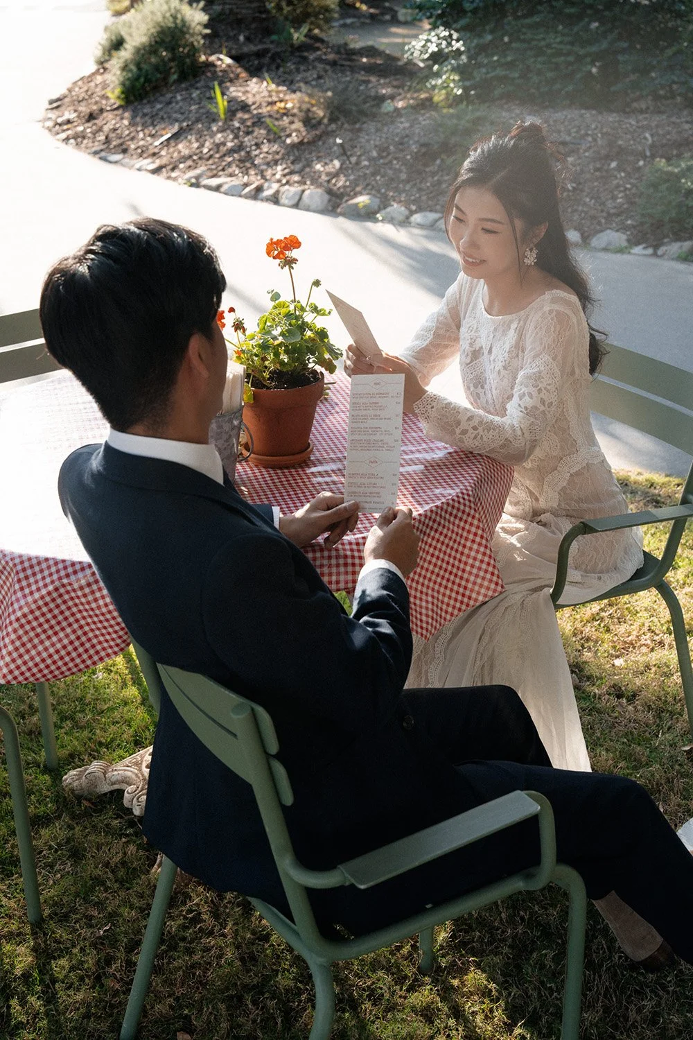 bride Cassie look at the menu with smile when sitting next to the table in Wilson Outlook Reserve