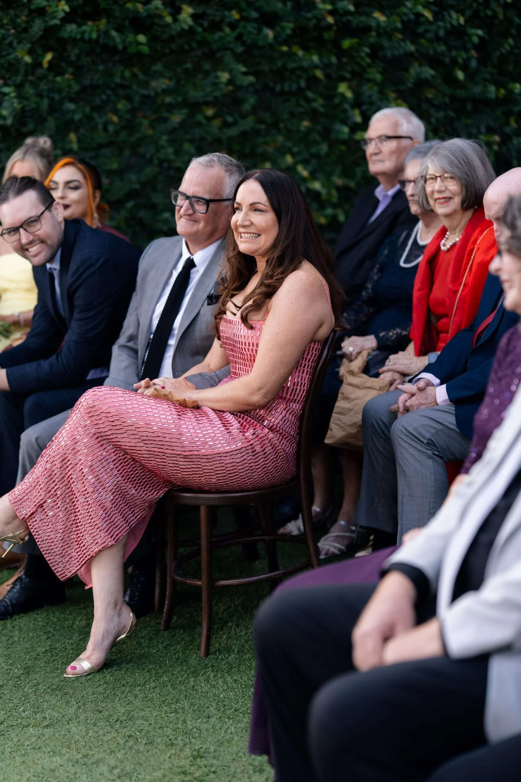 bride's parents laughing at wedding ceremony