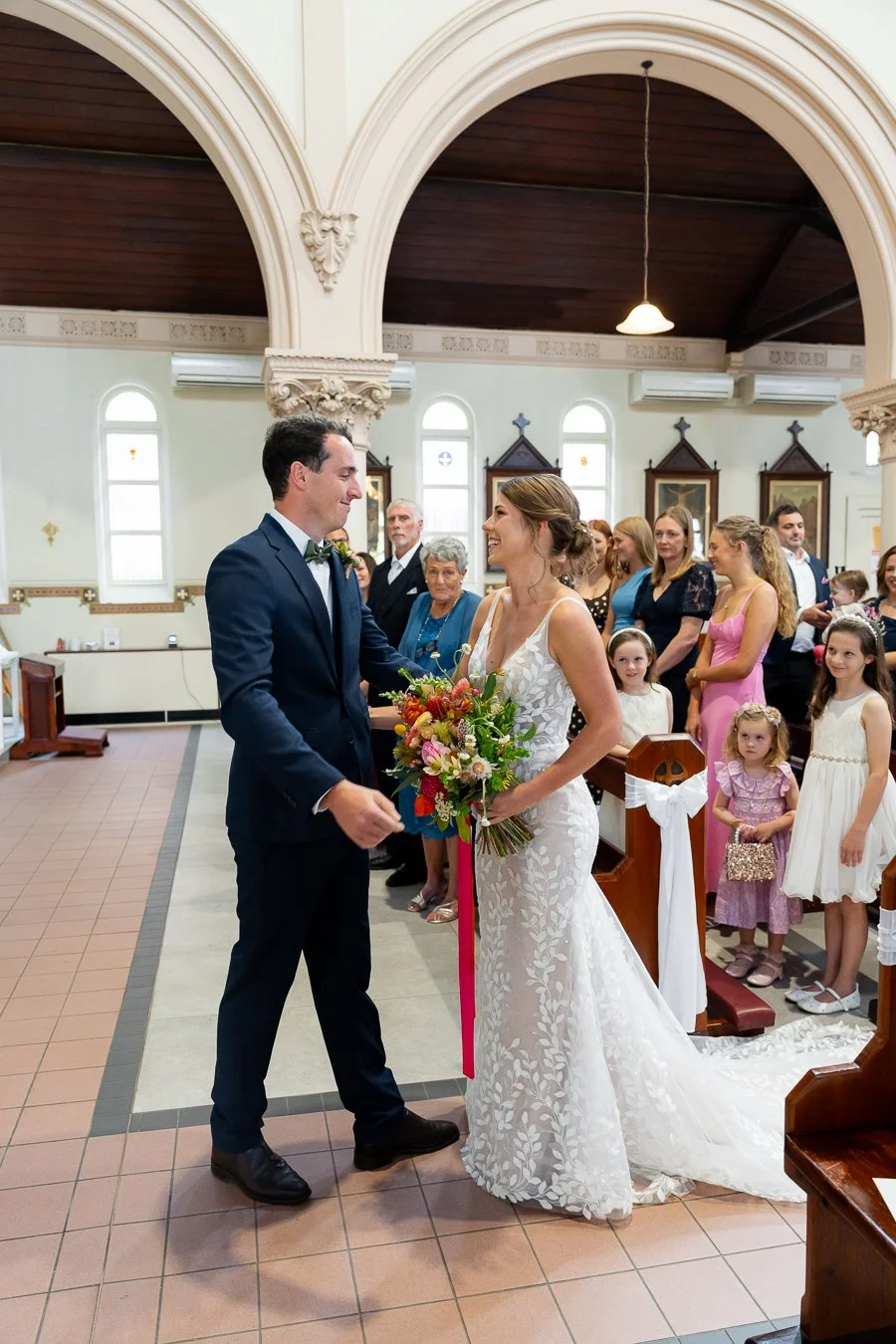 The groom reached out to embrace the bride.