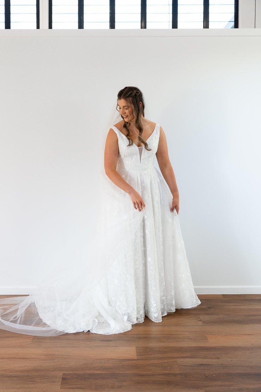 bride Chiarra look down to her trail