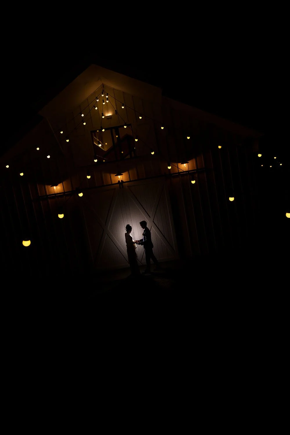 a little spot light behind Lisa and Michael, fair light on top with building