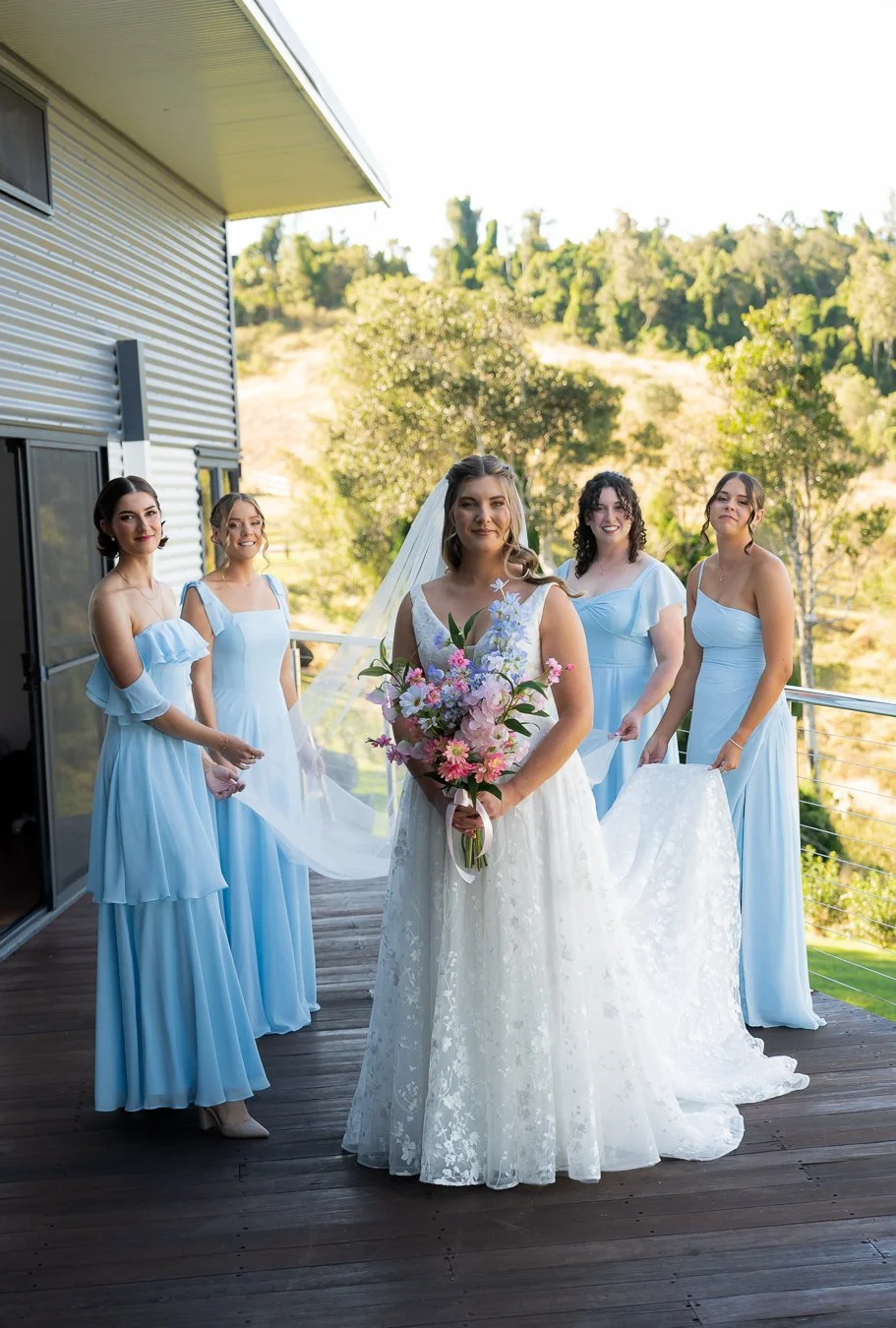 Chiarra and her bride mates all look at the Brisbane wedding photographer Whistler Li