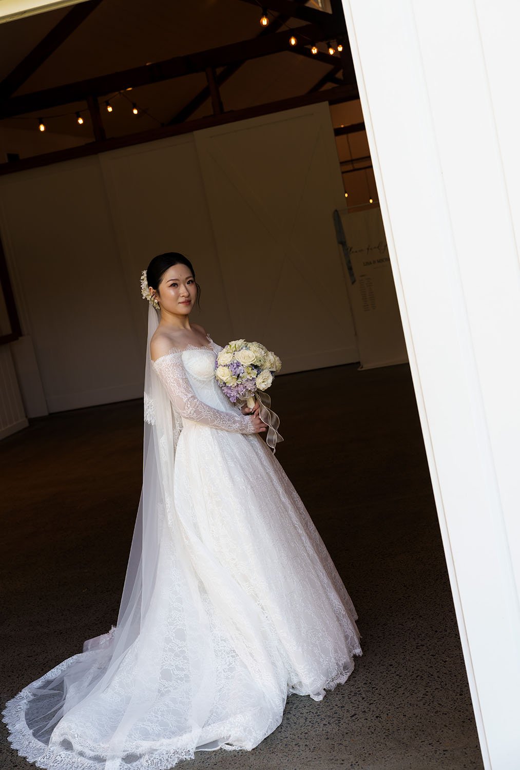 Lisa holding her flower look at the Brisbane wedding photographer Whistler Li