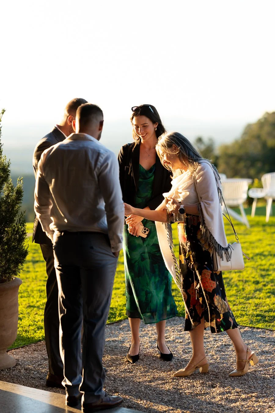 a female guest look at Ben's wedding ring