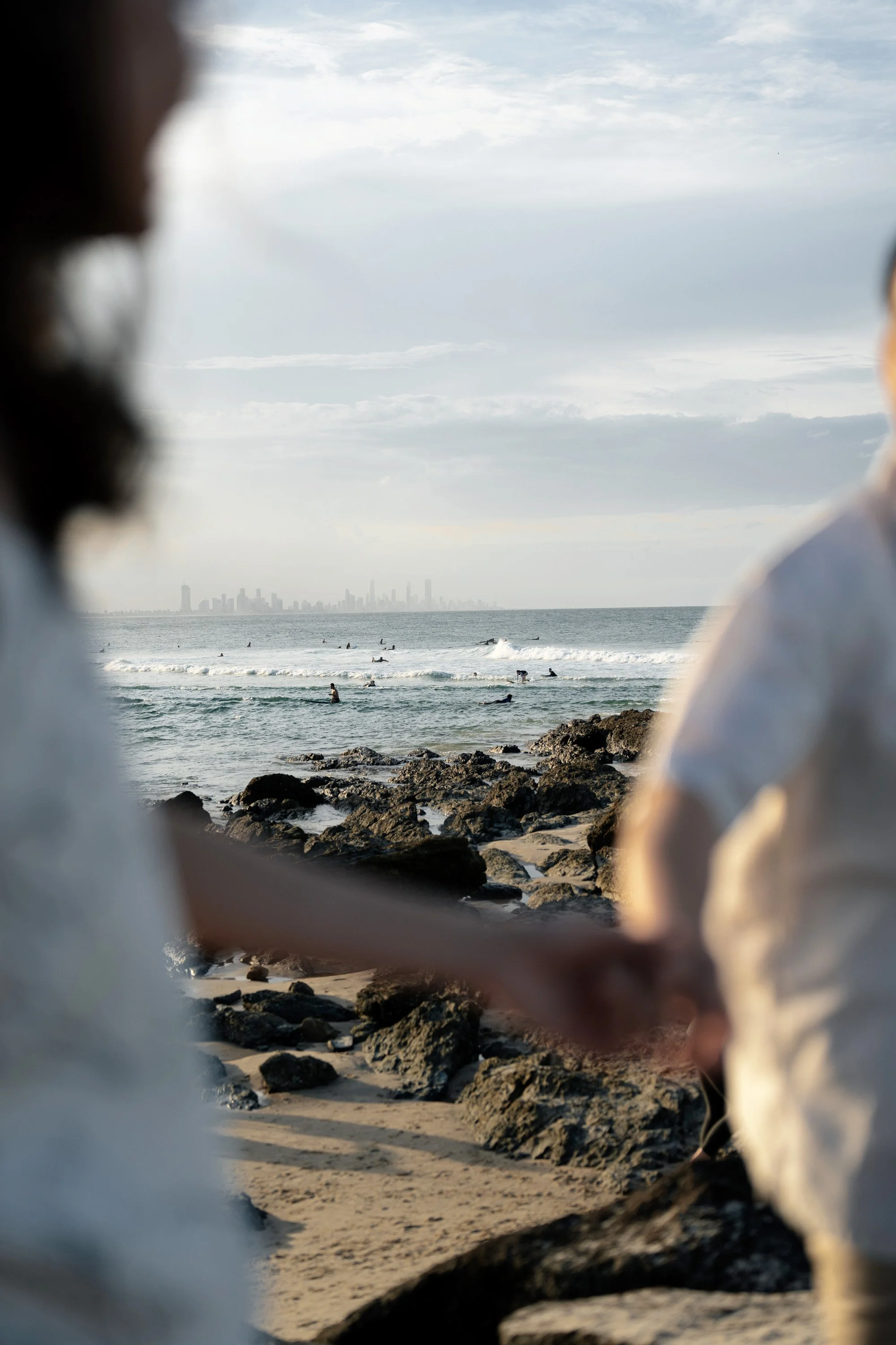 Gold Coast city view, and people surfing at the background