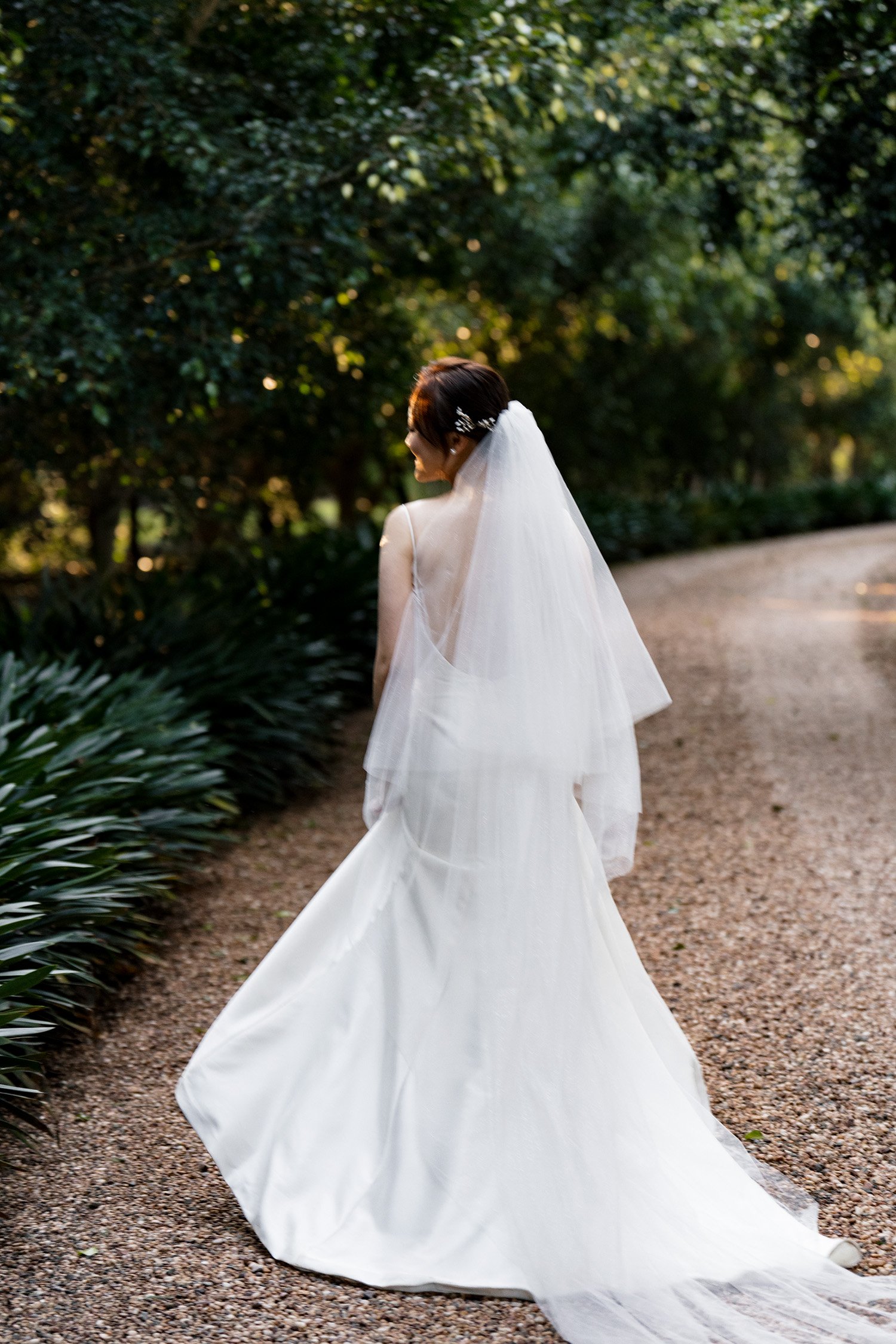 bride Vicky's face towards to the sun and show her back to the camera
