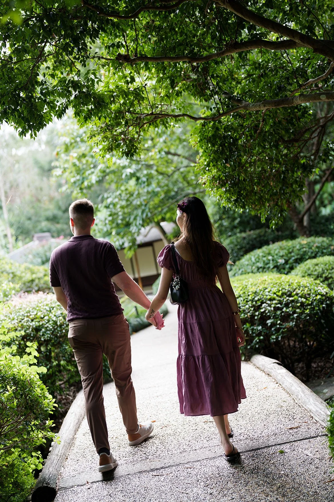 They walked hand in hand toward the end of the path.