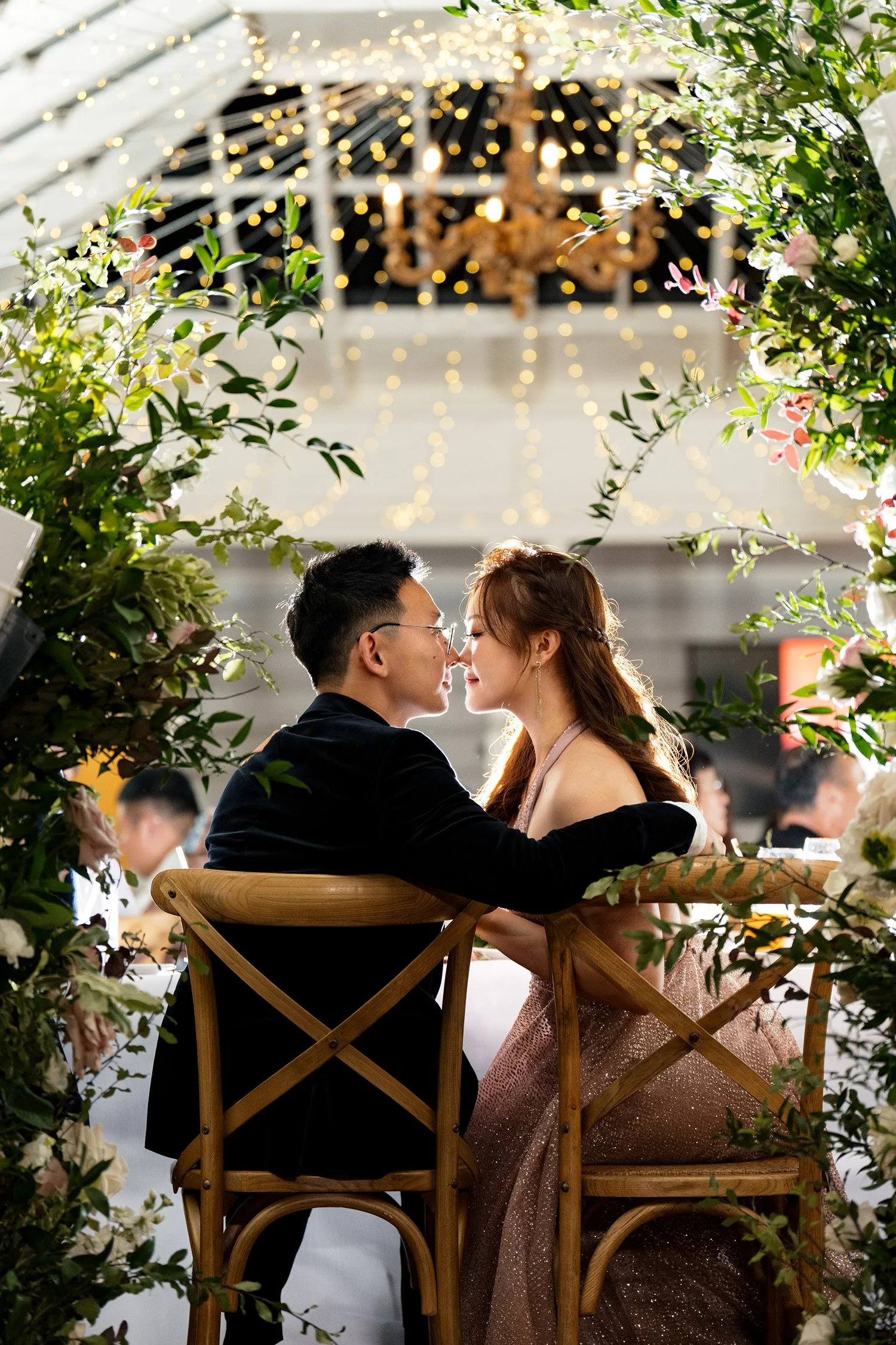bride and groom nose touch nose with a flash back light at reception room in Gabbinbar Homestead