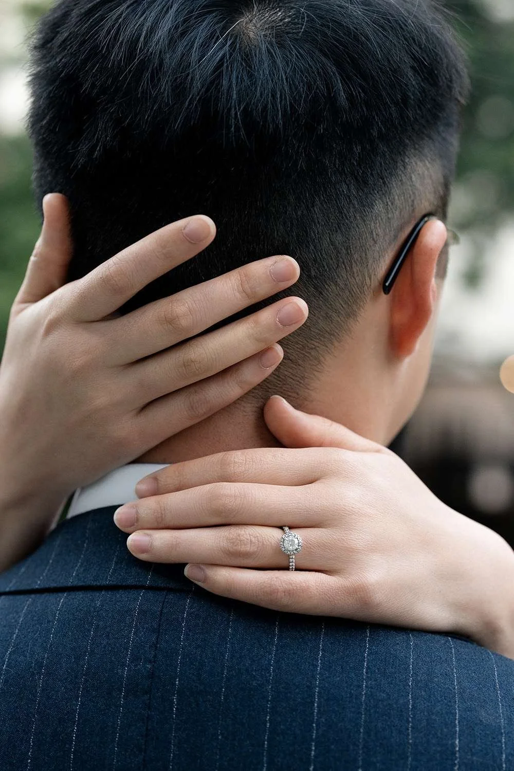 Kath's hands gently holding Dave's neck, capturing an intimate and affectionate moment between the couple