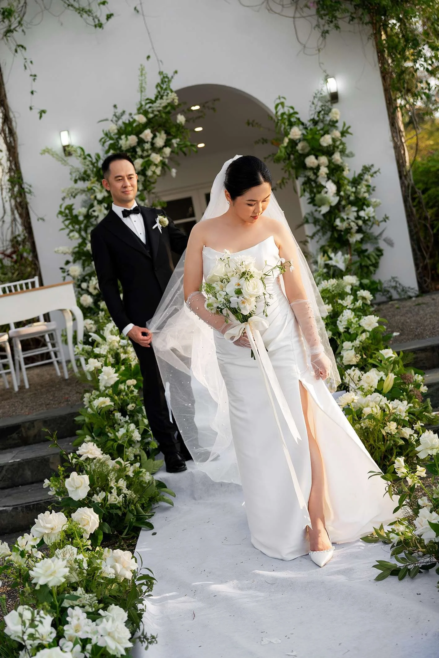 bride Wendy look down, groom Alex look at her