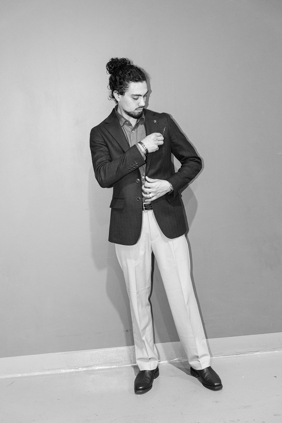 Junaid touching his pocket square