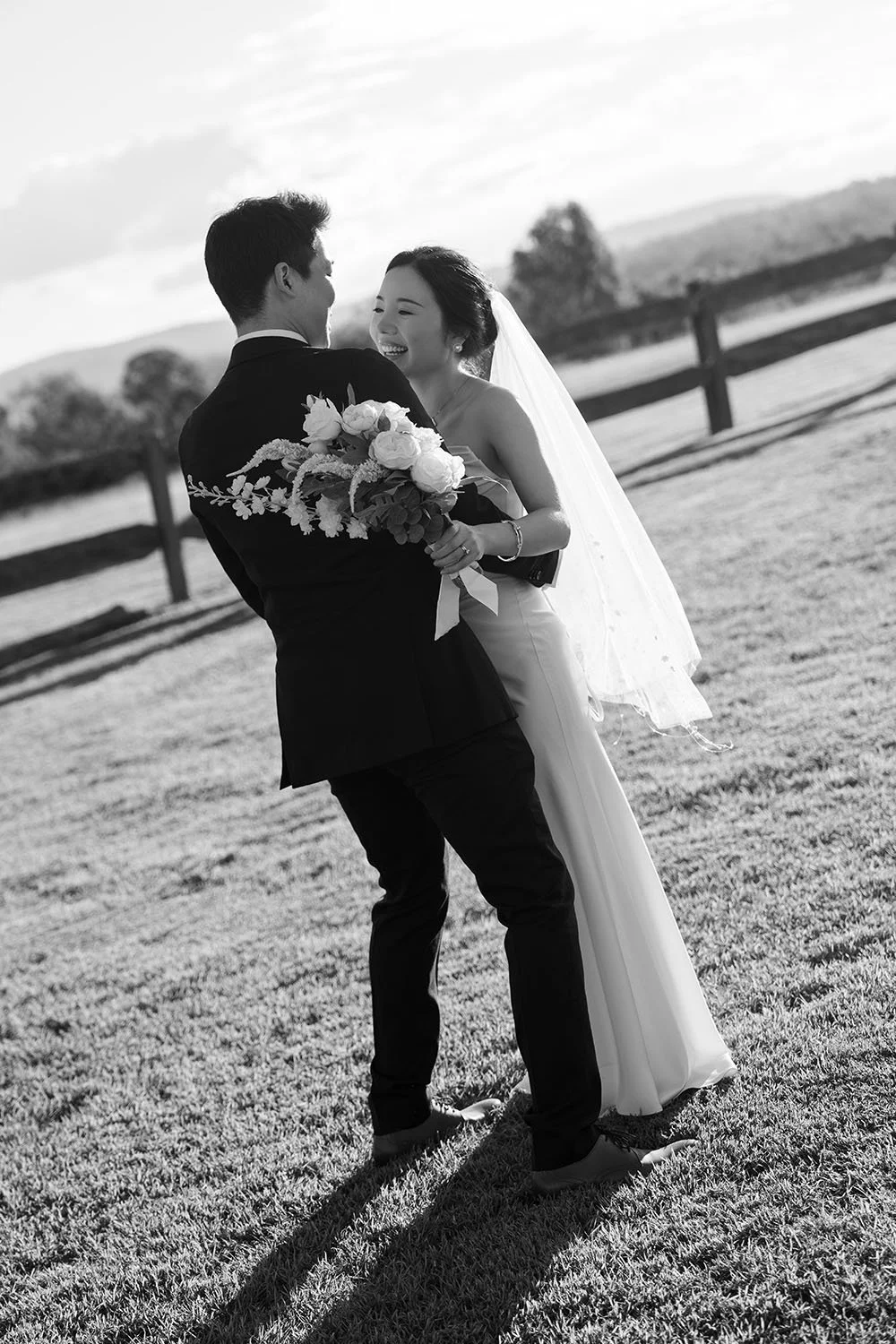 Eric and Flora holding each other with laughing