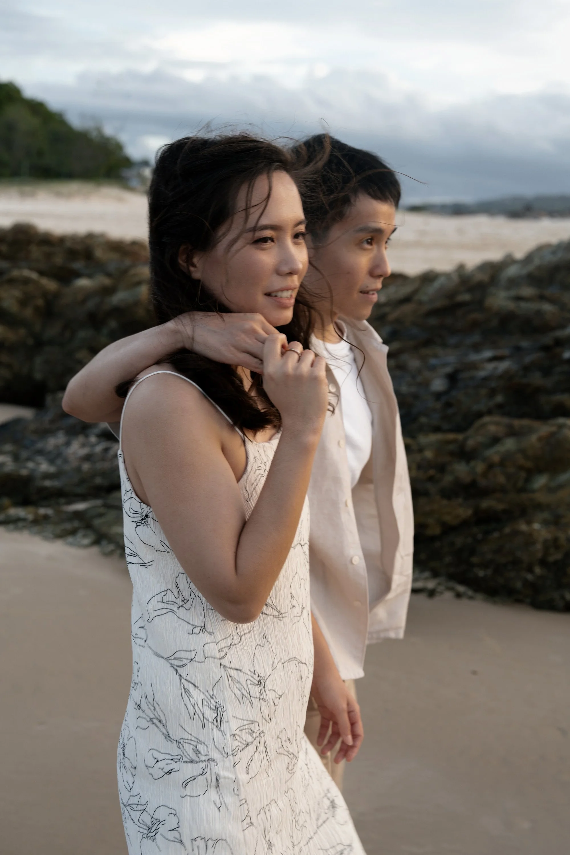 Paul holding Krystel's shoulder when walking together in Currumbin Alley