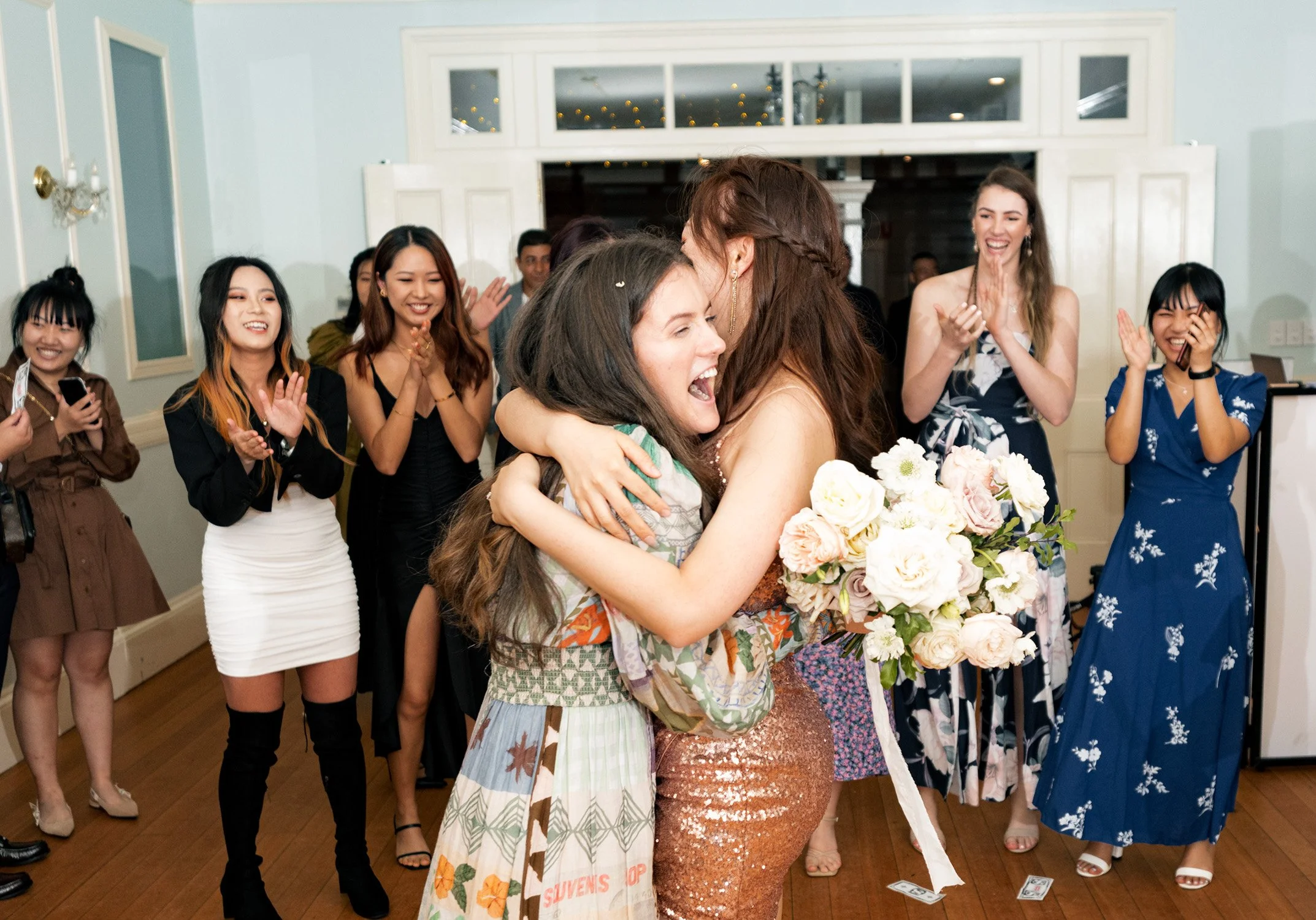 a lady who catch the bridal bouquet and hug the bride in gabbinbar homestead