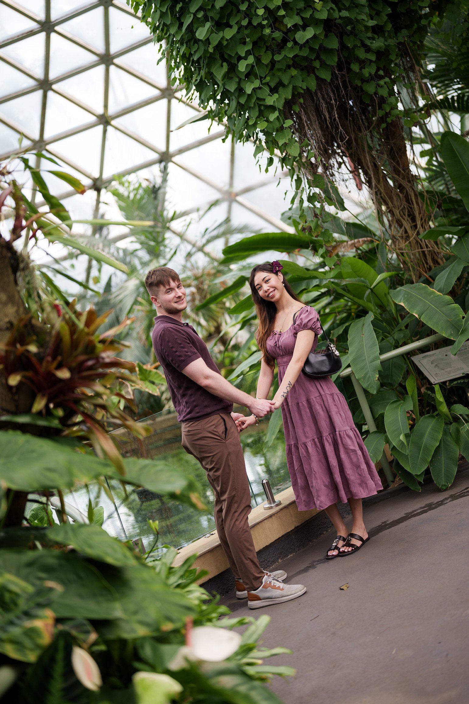 They stood face to face, holding hands, looking together toward the Brisbane wedding photographer Whistler Li.