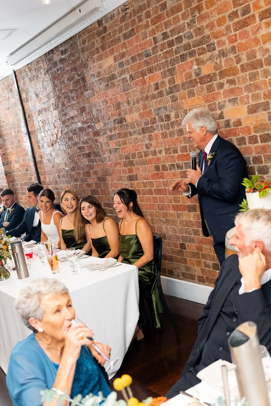 Sonya's father making a speech and make all bridal party laughing in reception
