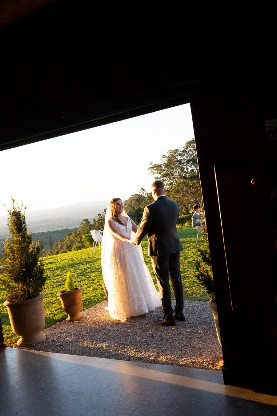 bride Chiarra and groom Ben hands holding together laughing when stand face to each other