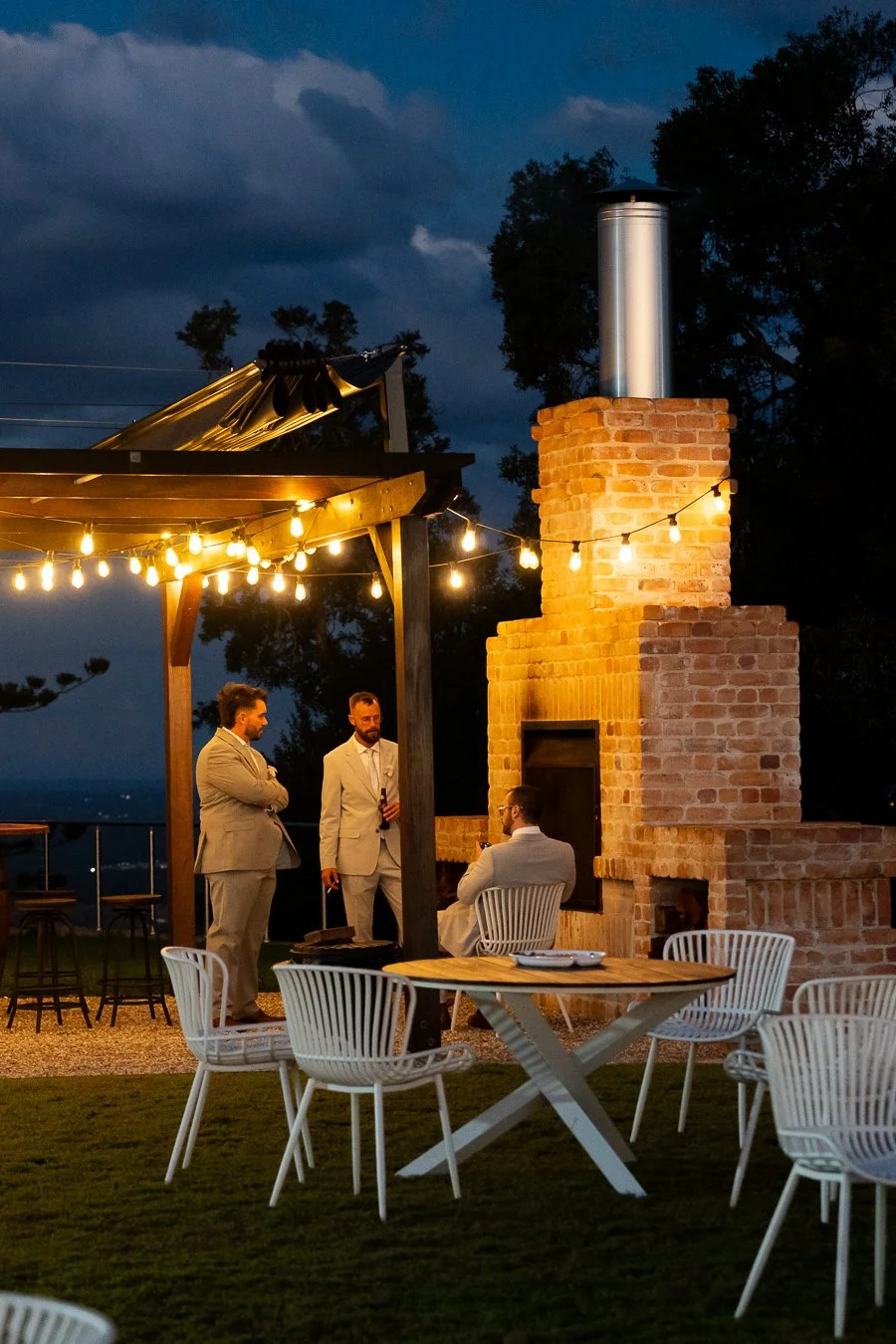 groomsman tabling near a fireplace