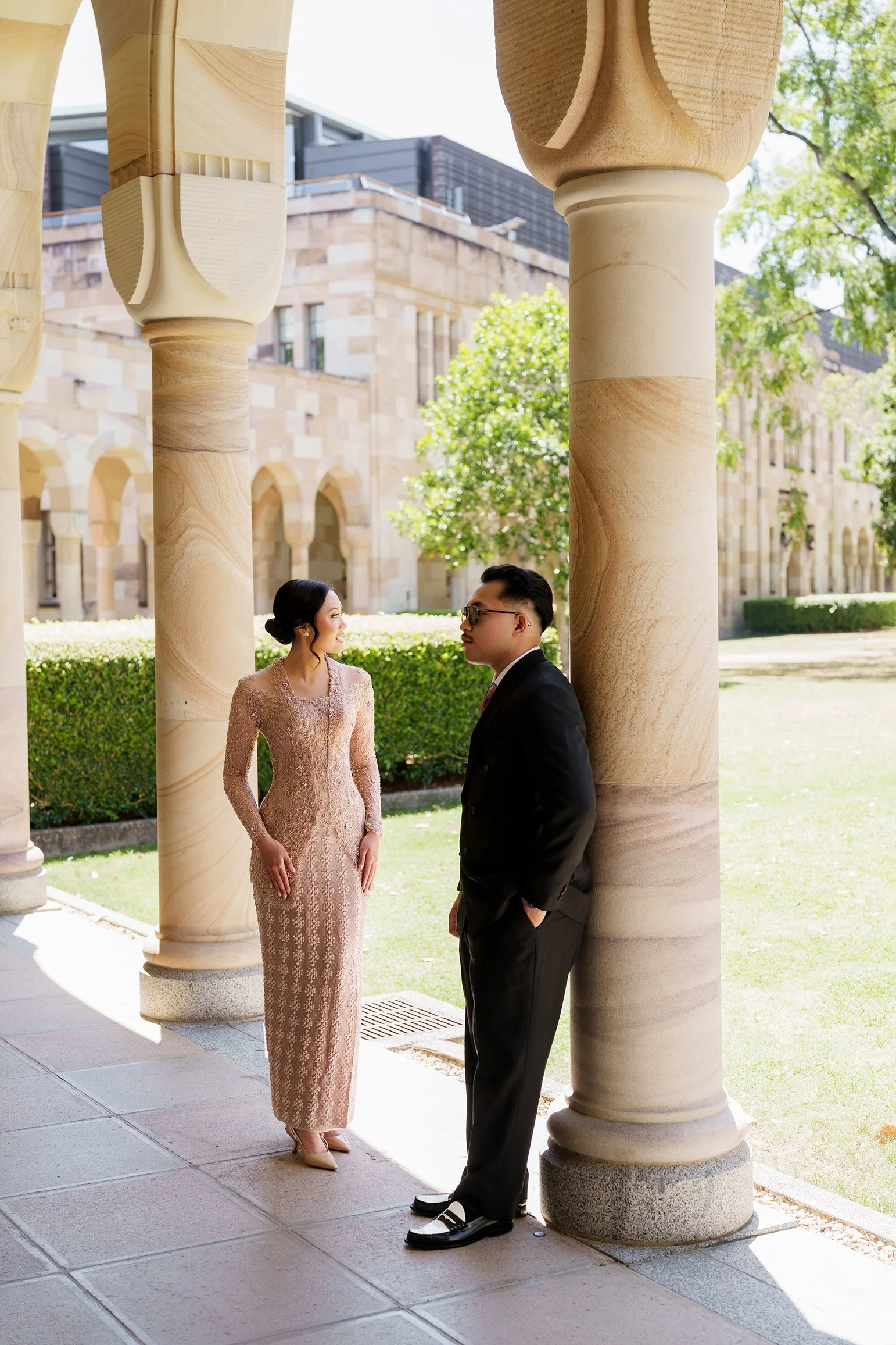 Aka back against the column look straight ahead and Bella look away too