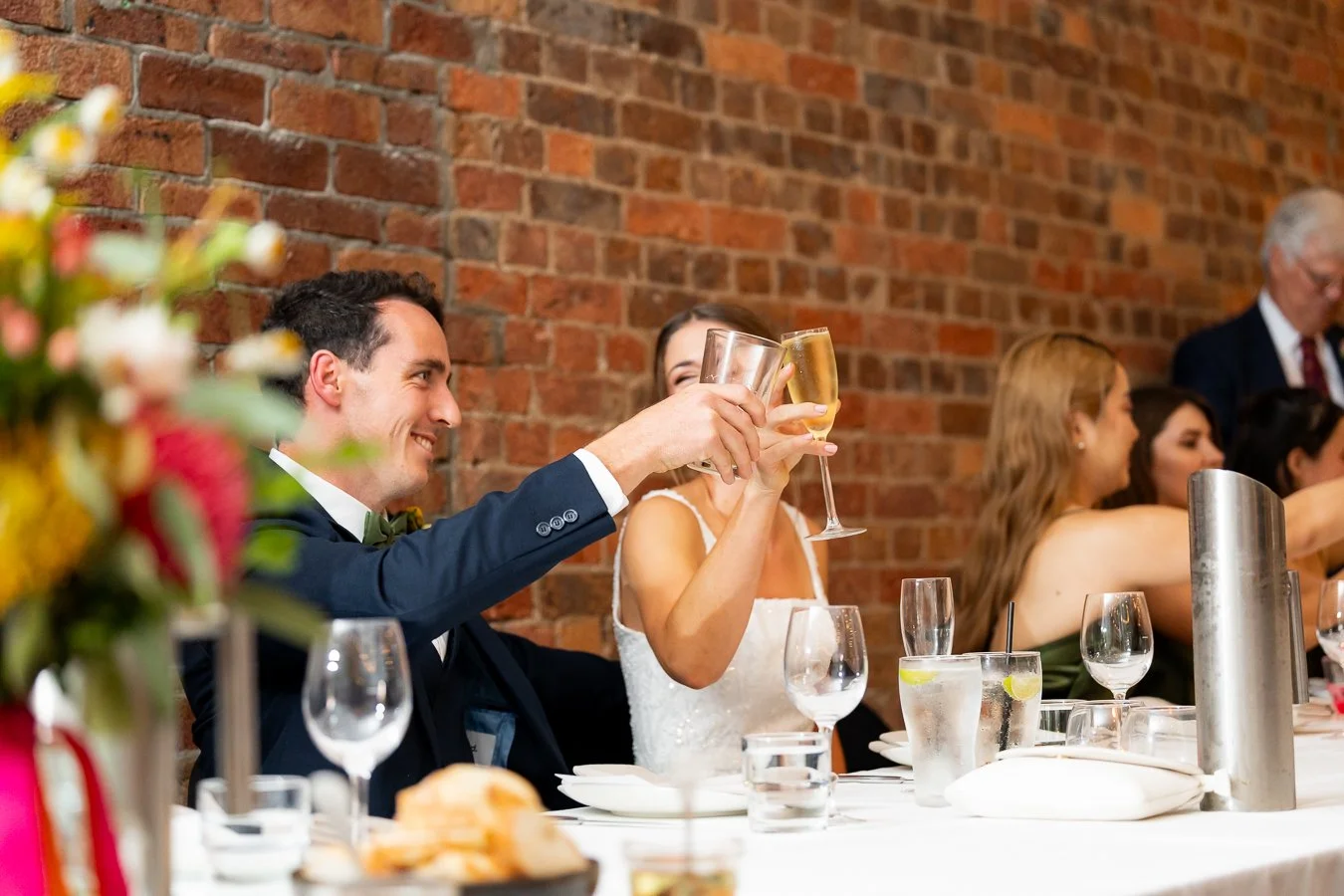 bride and groom's glass together