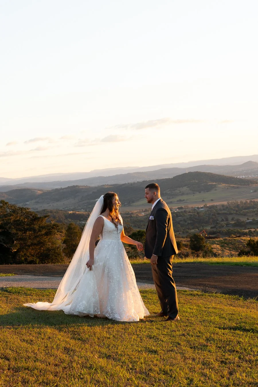 bride Chiarra face to groom Ben and they talking, mountain view behind them in Western Ridge