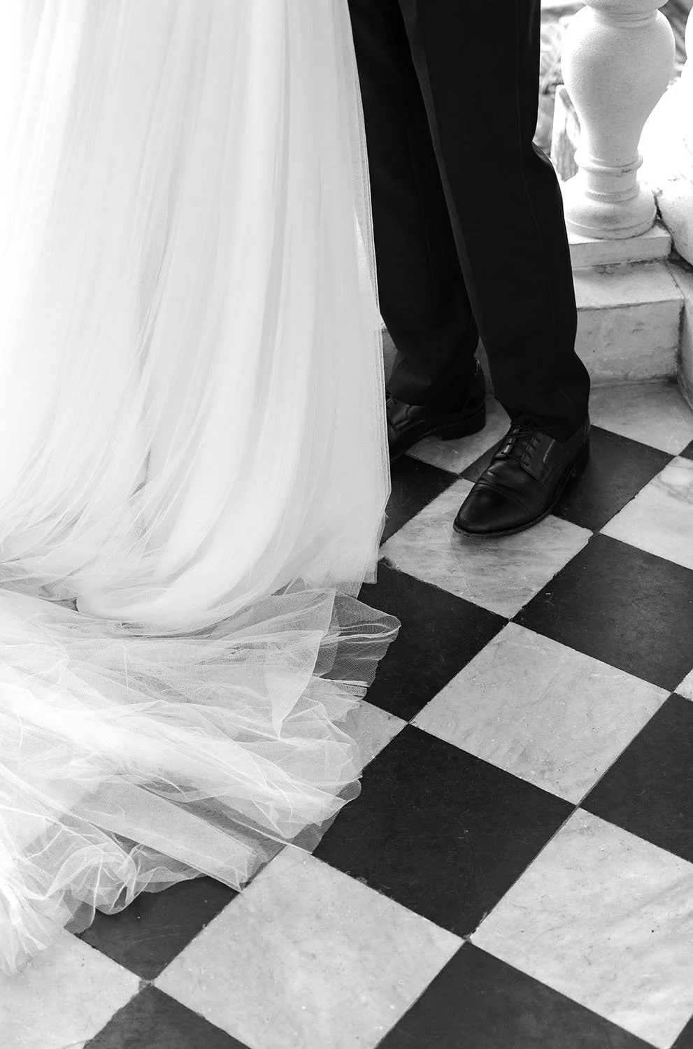 feet on top of the black and white square tile