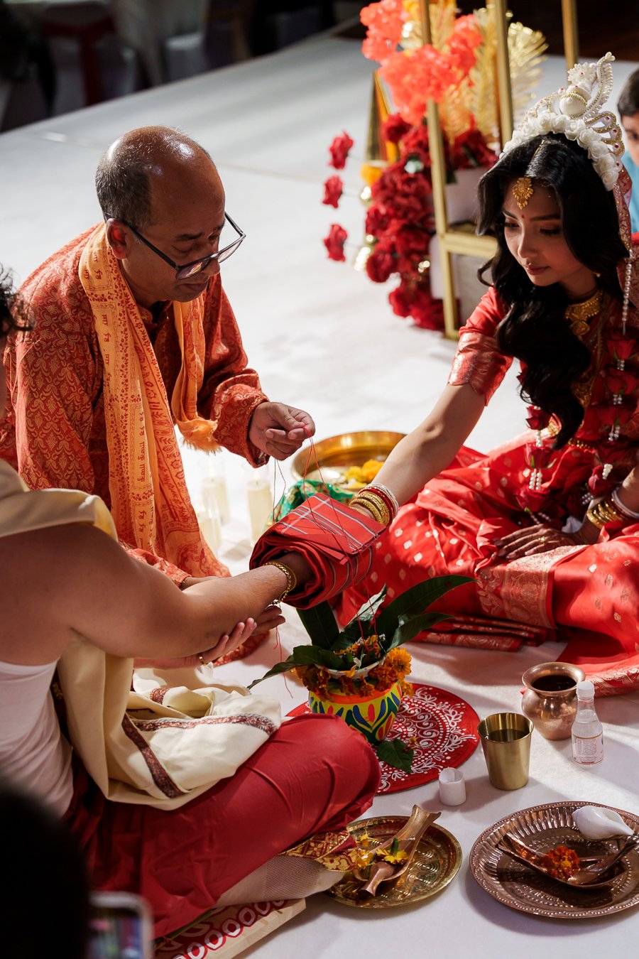 priest wrap the red link for their red cloth up to s pot