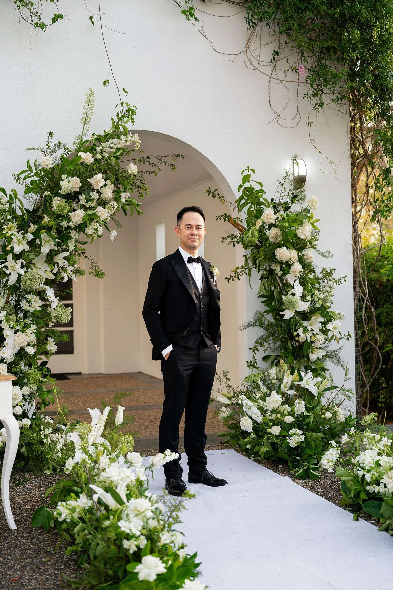 groom Alex two hands inside the pants pocket