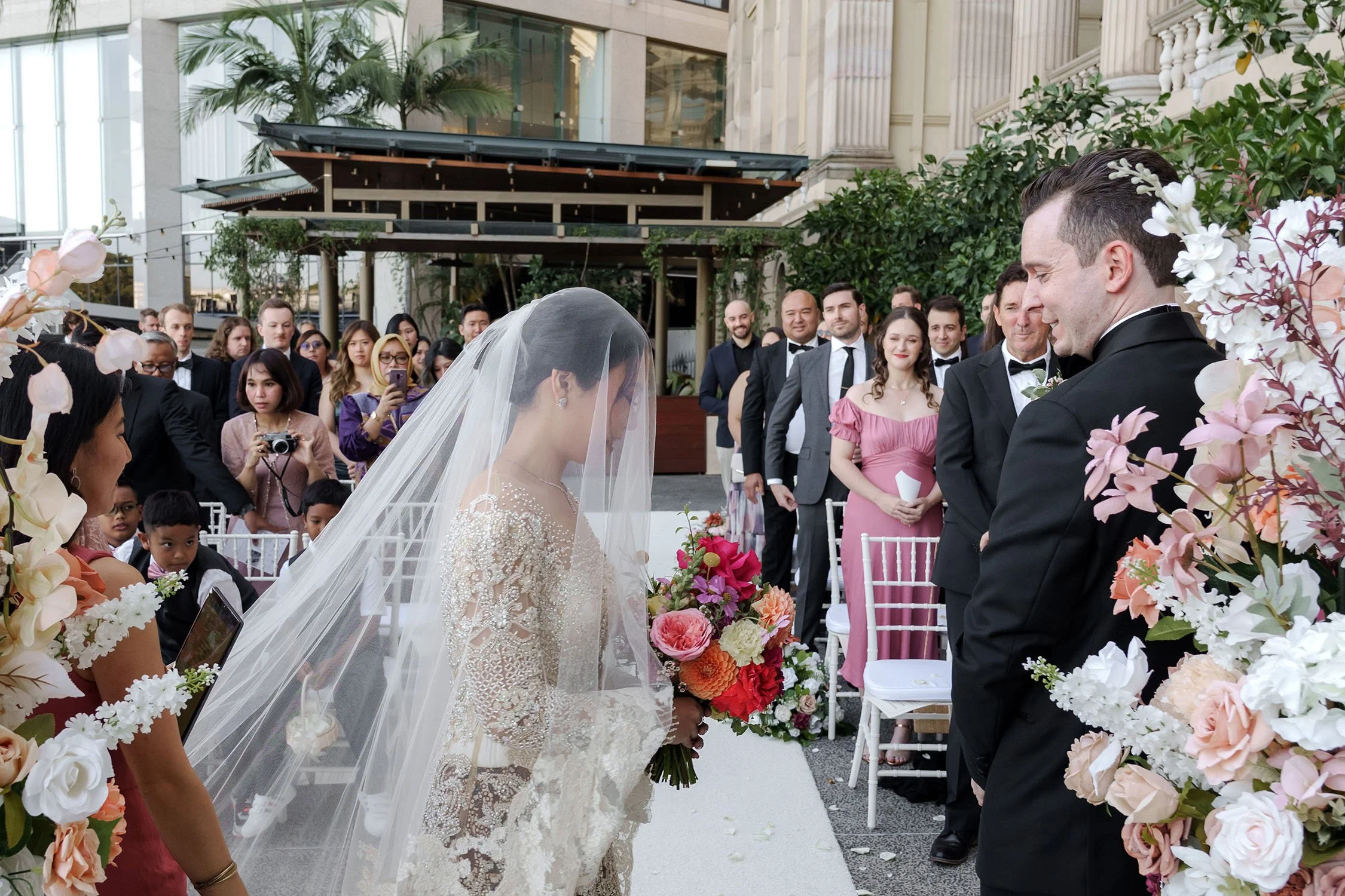 The bride with her veil over her face