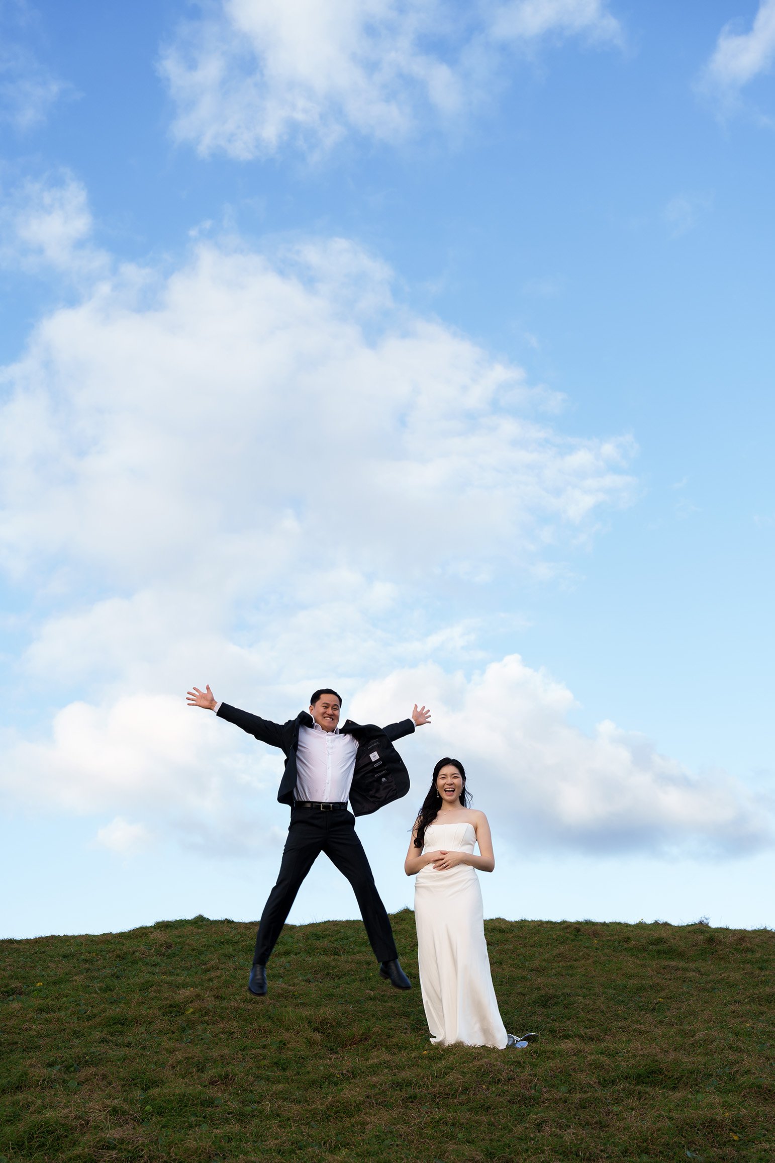 Silva jumping and Margaret stand next to him