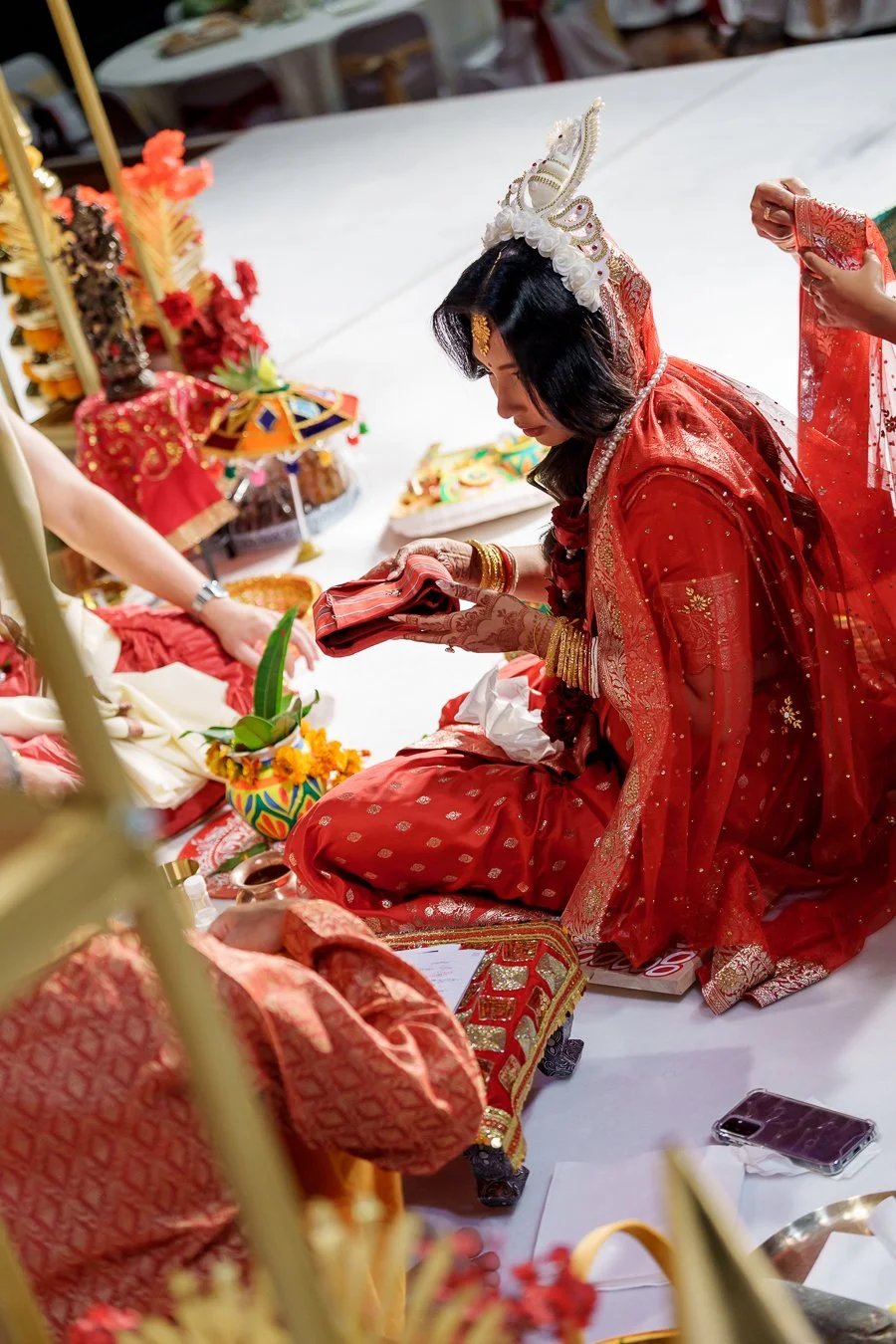 Amrita holding a red cloth