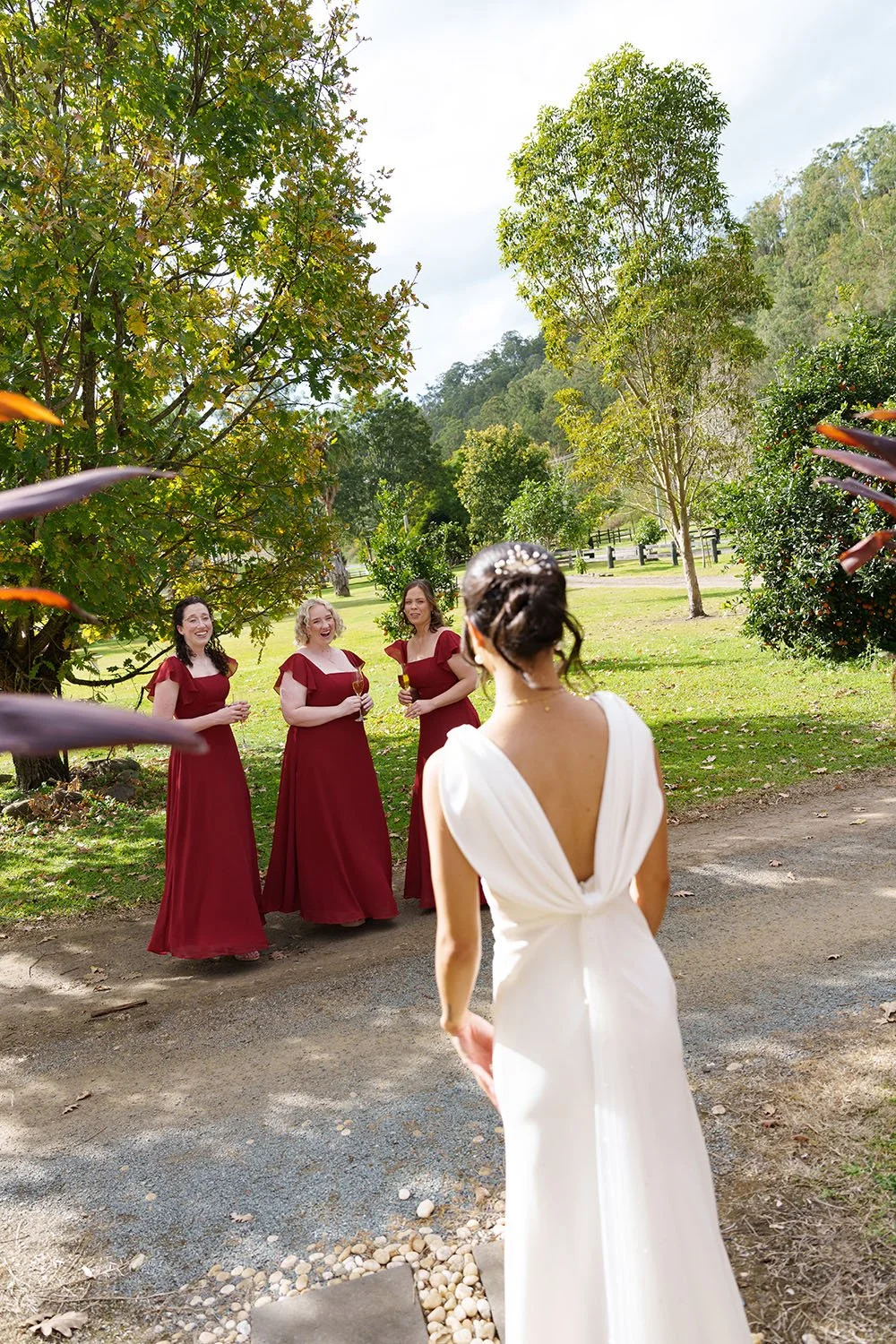 brides mates turn and see Jasmin in her wedding dress