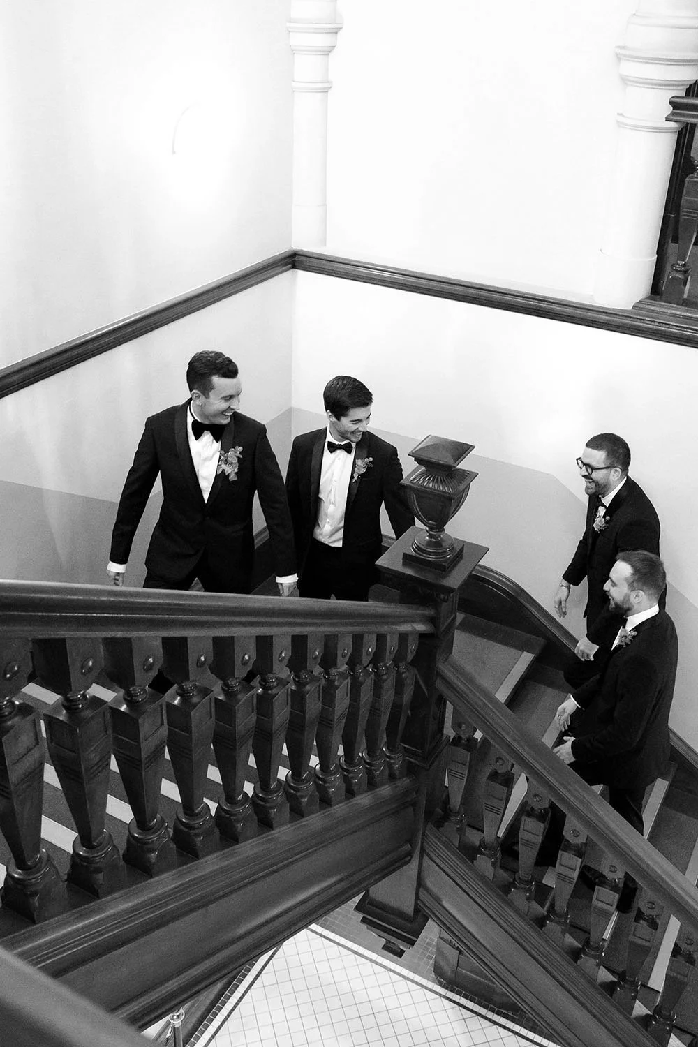 groom Cliffe leading the groomsmen waling up the stairs