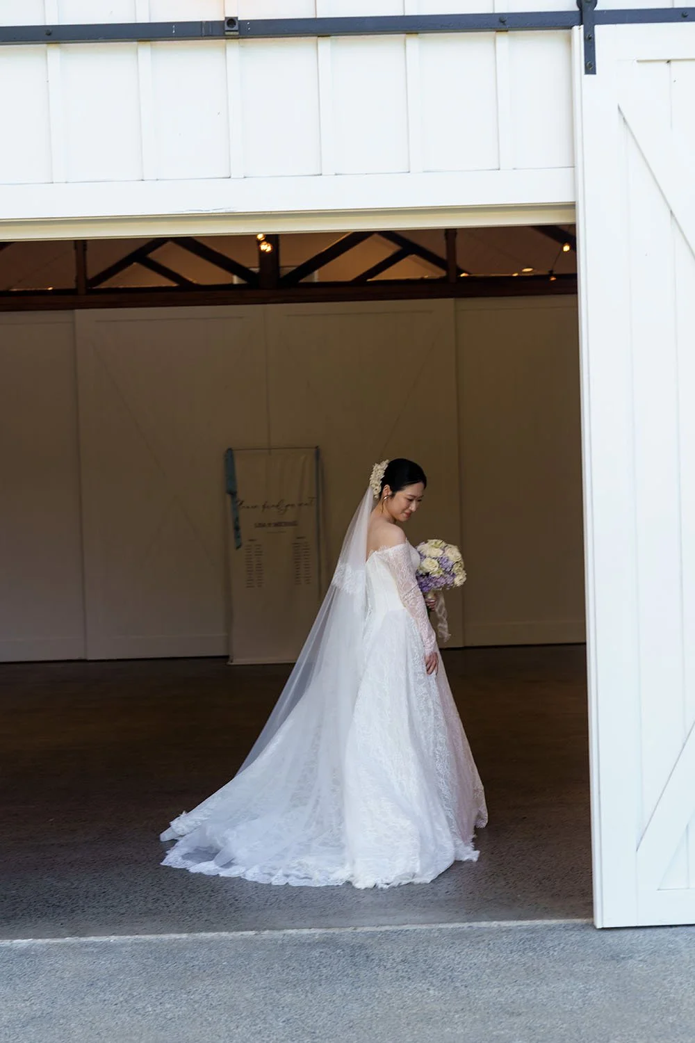 Lisa in her wedding dress and look down