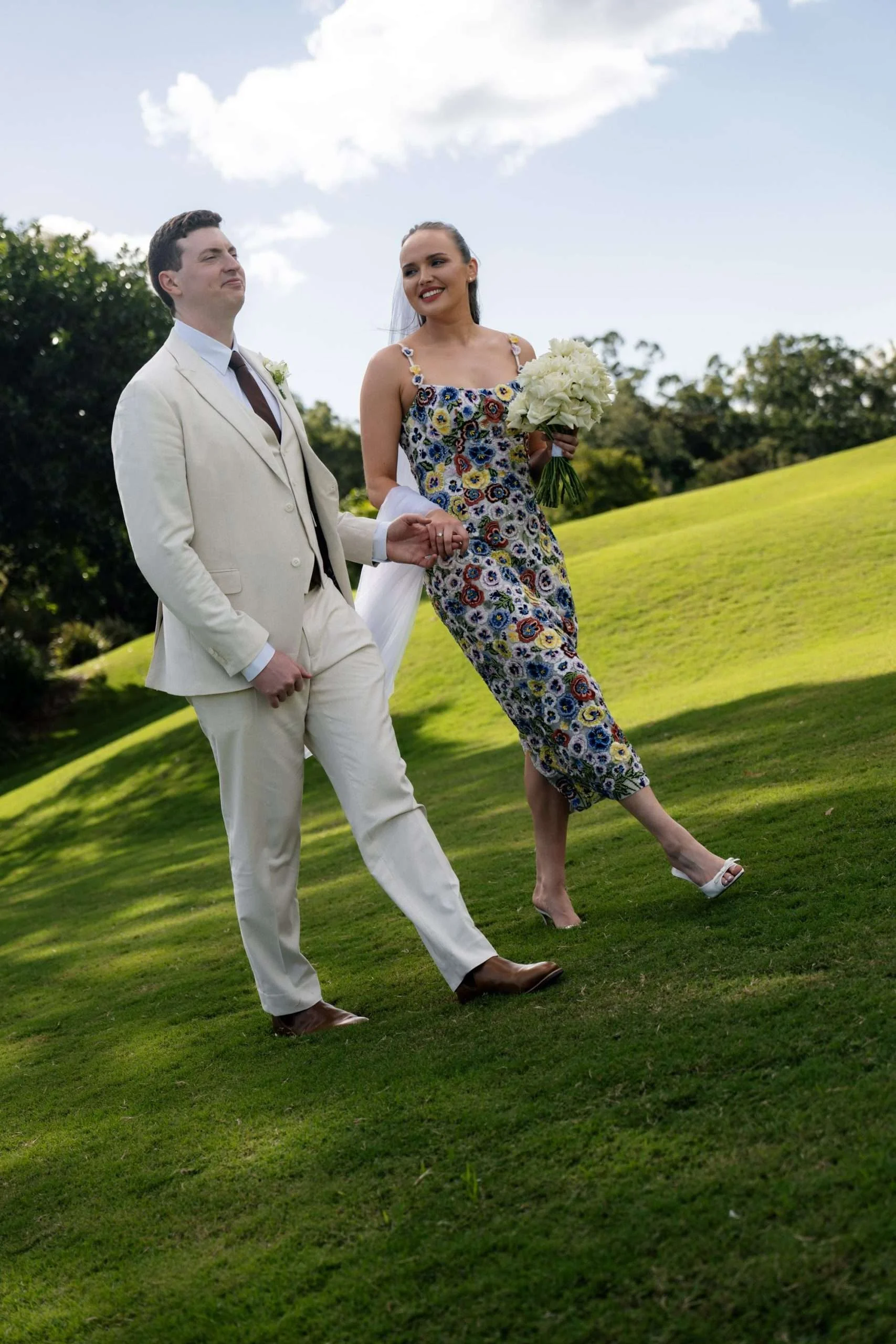 Bride and groom holding hands and walking together
