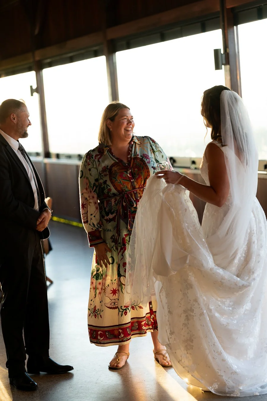bride smell talking to two guests
