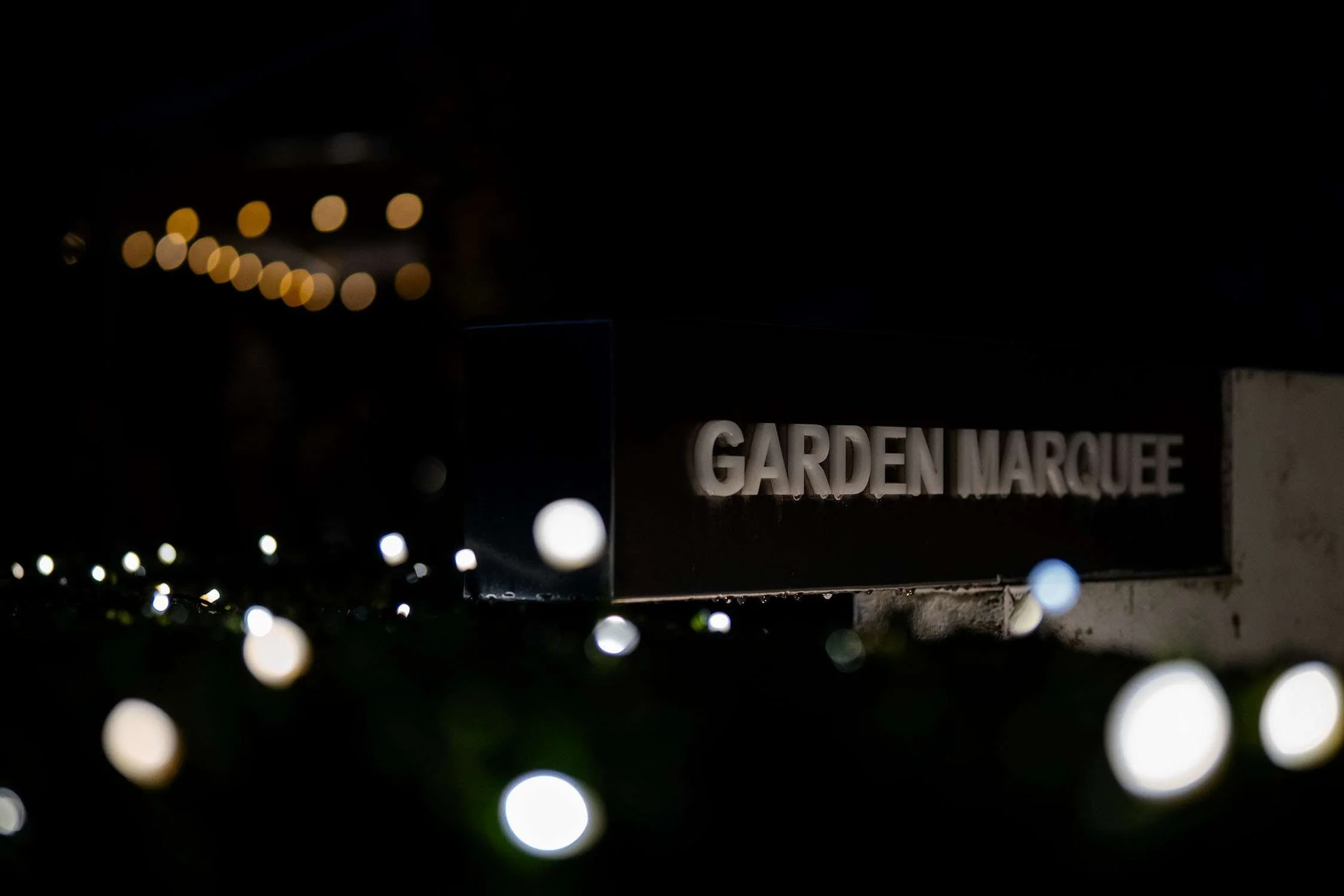 garden marque signage in dark night with lights